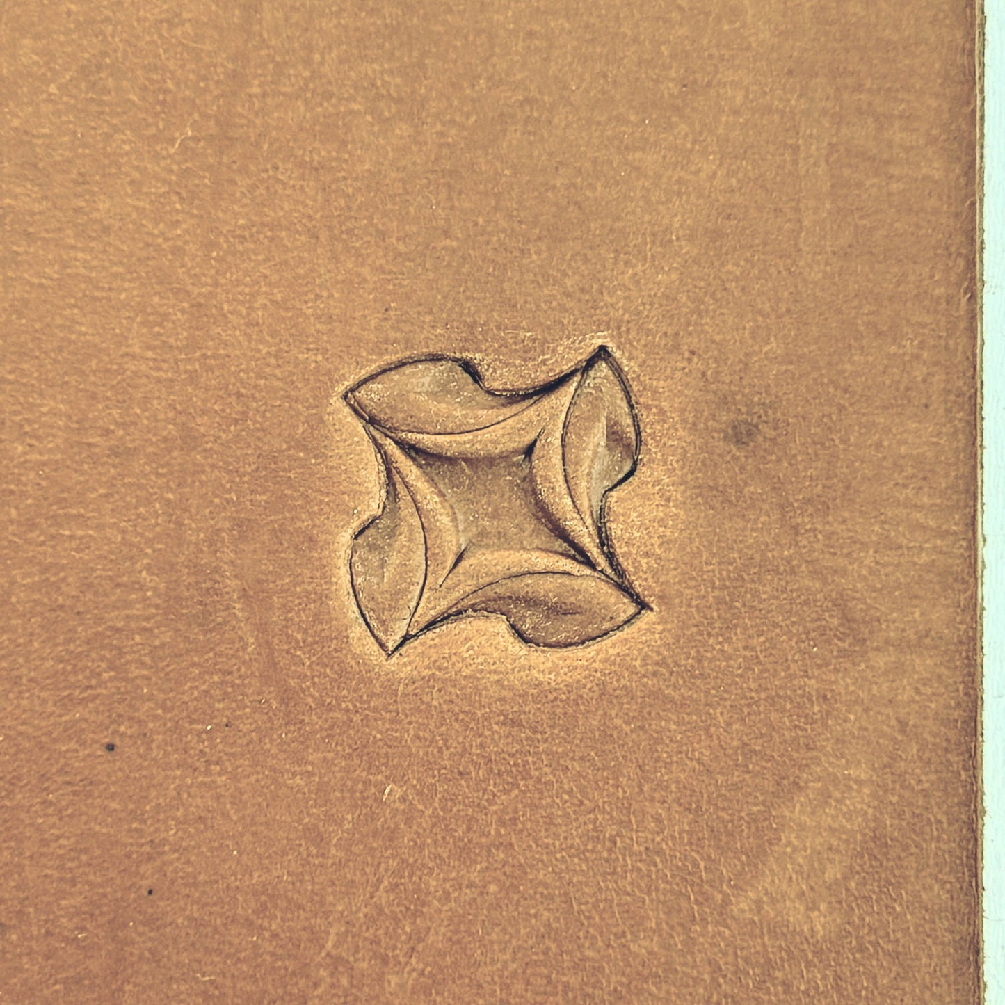 Petal Geometry leather stamp LT208 — single impression on veg-tan leather