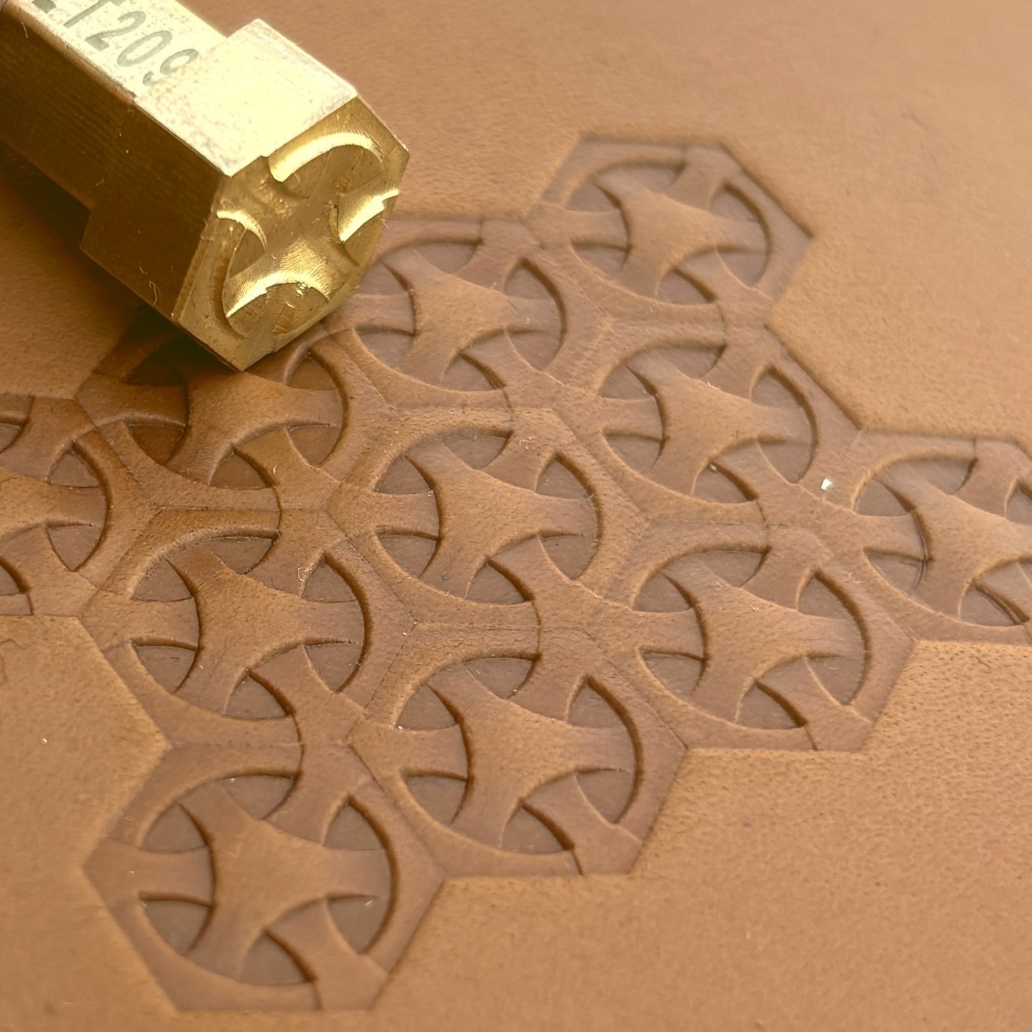 Geometric leather stamp LT209 — brass stamping tool with imprint on natural veg-tan leather