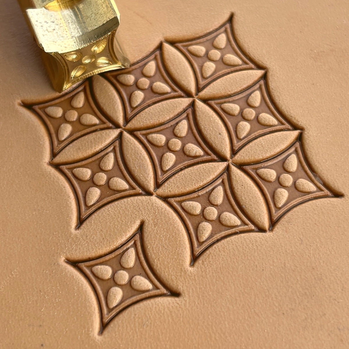 Geometric leather stamp LT222 — brass stamping tool with imprint on natural veg-tan leather