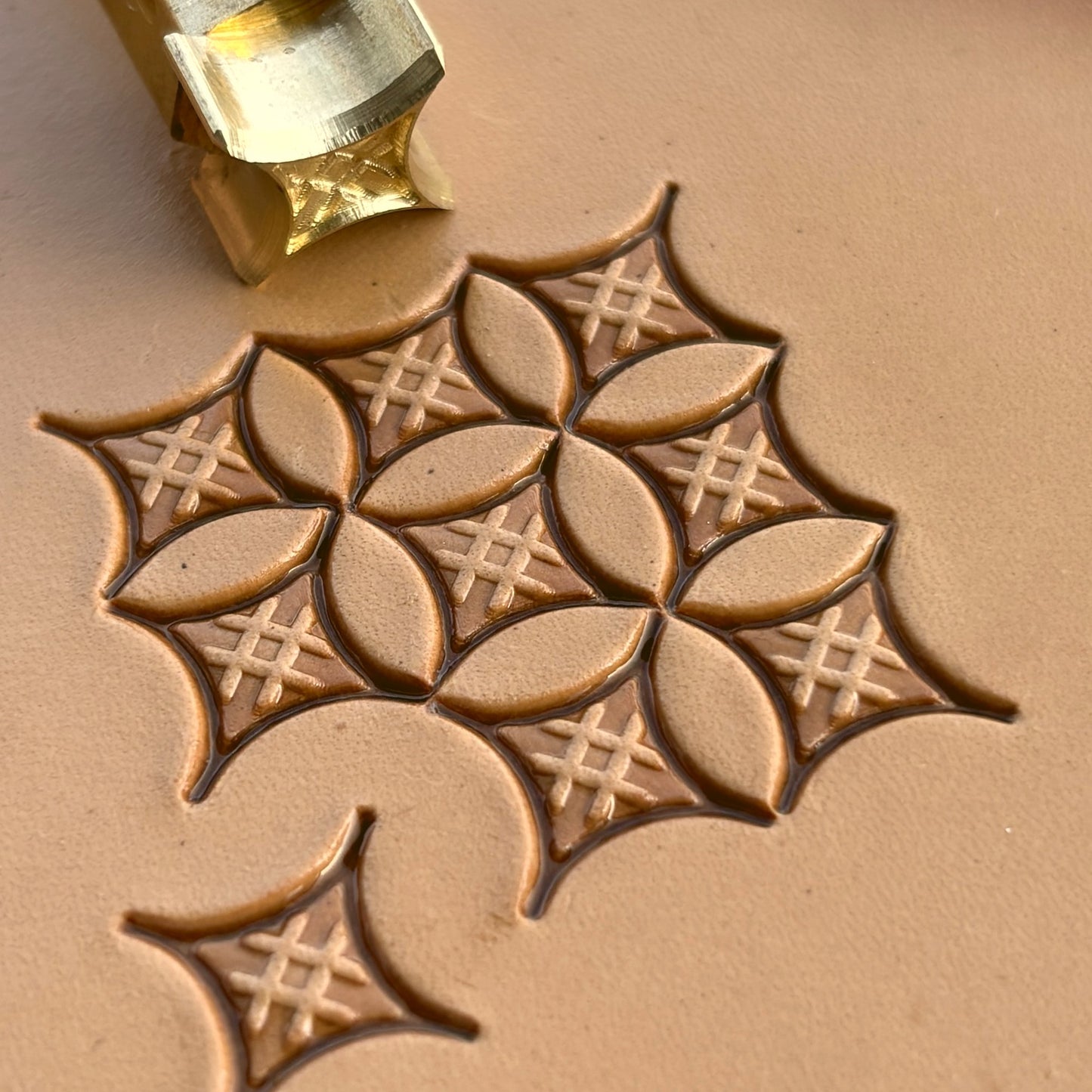 Geometric leather stamp LT226 — brass stamping tool with imprint on natural veg-tan leather
