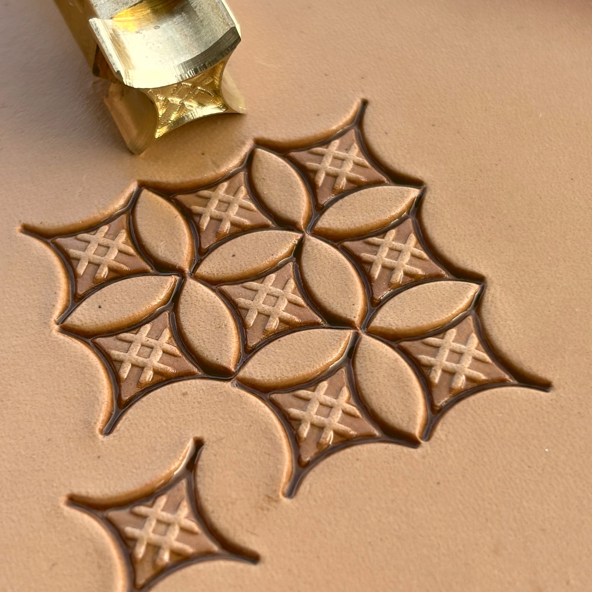 Geometric leather stamp LT226 — brass stamping tool with imprint on natural veg-tan leather