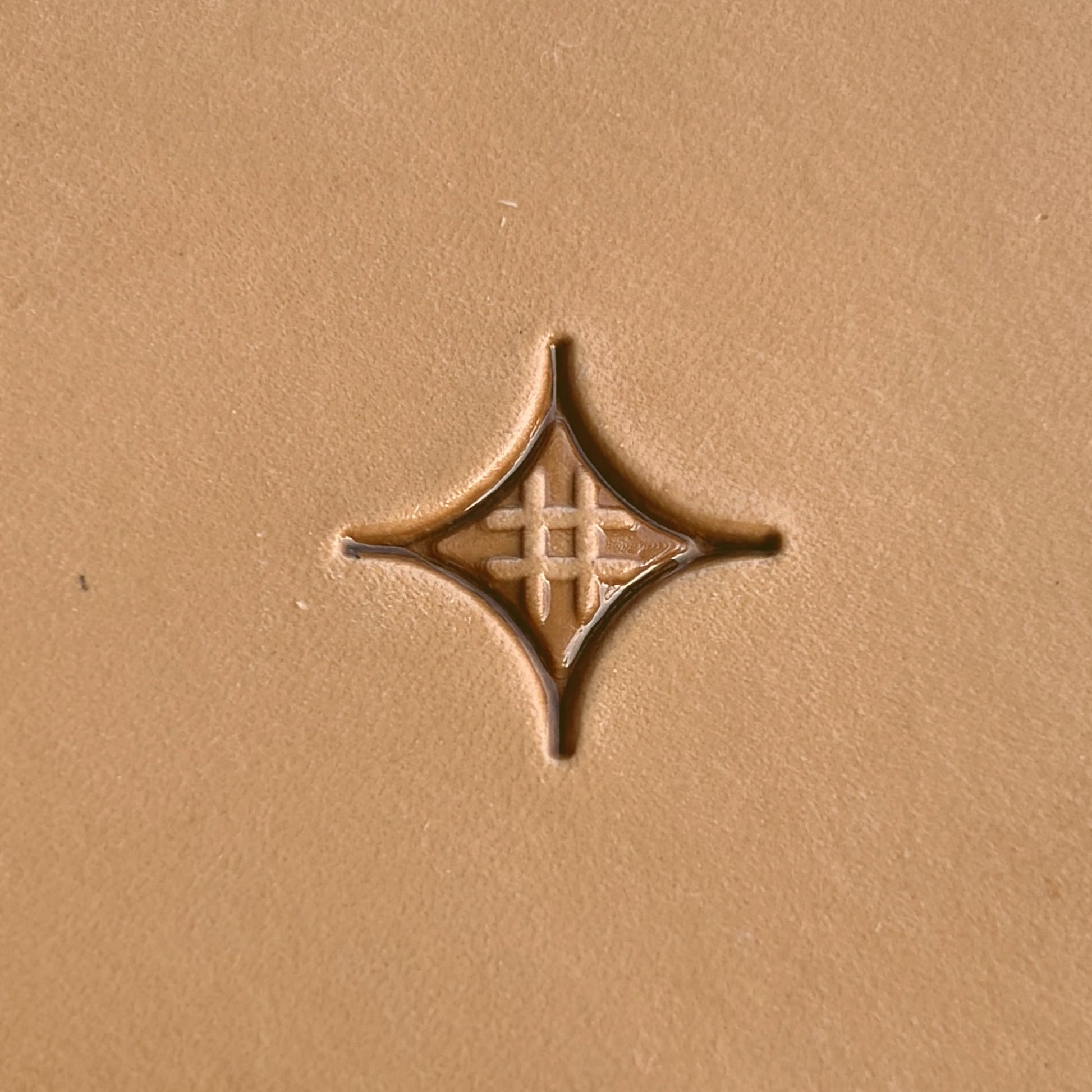 Geometric leather stamp LT226 — single impression on veg-tan leather