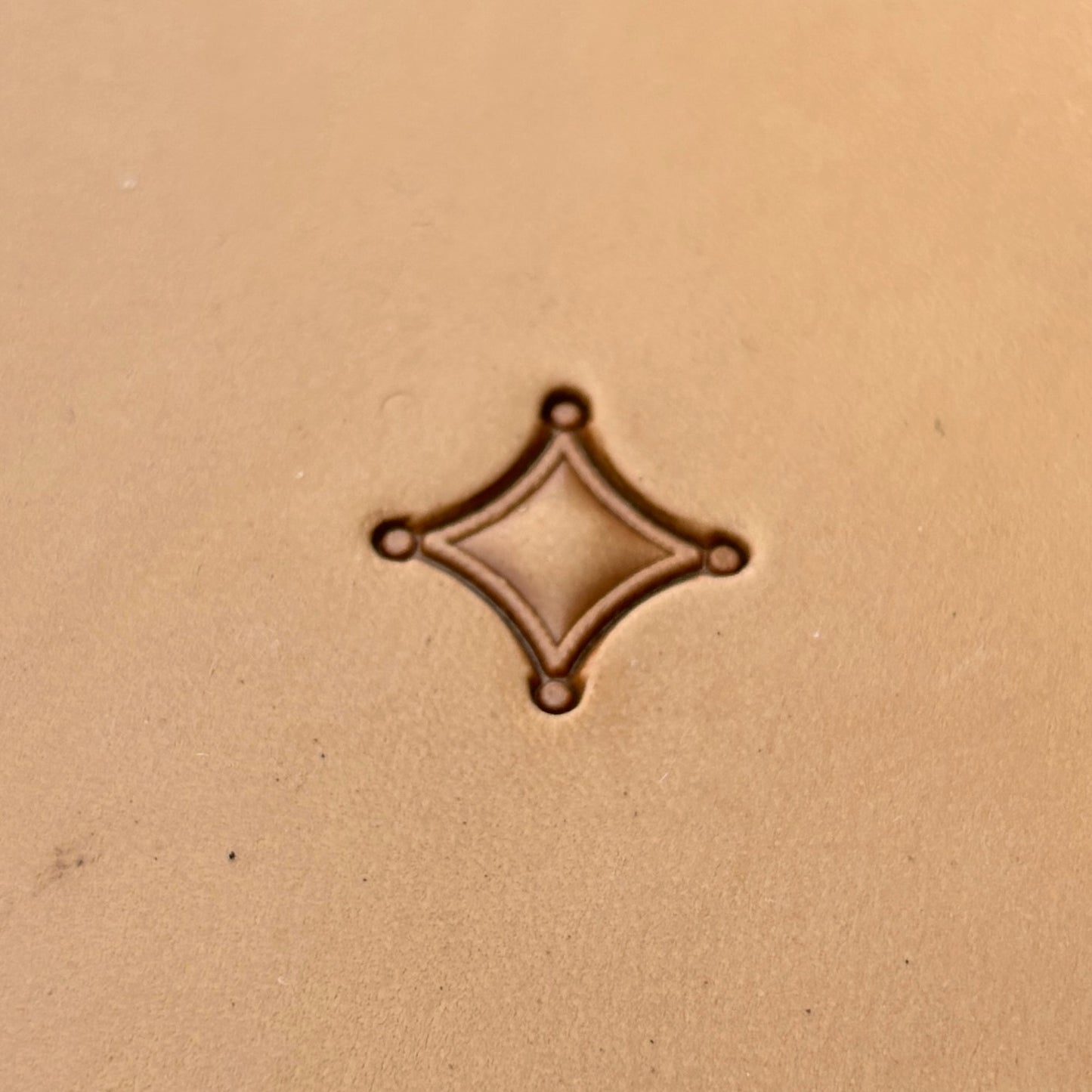 Overlapping Diamonds Geometric leather stamp LT227 — single impression on veg-tan leather