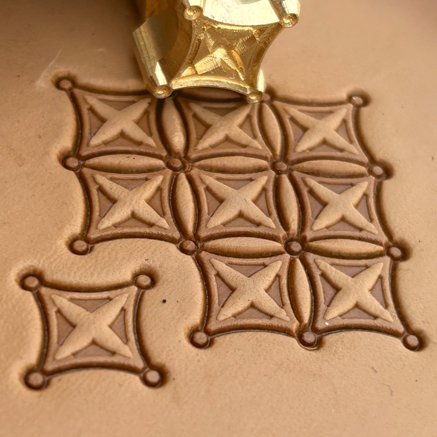 Geometric leather stamp LT228 — brass stamping tool with imprint on natural veg-tan leather