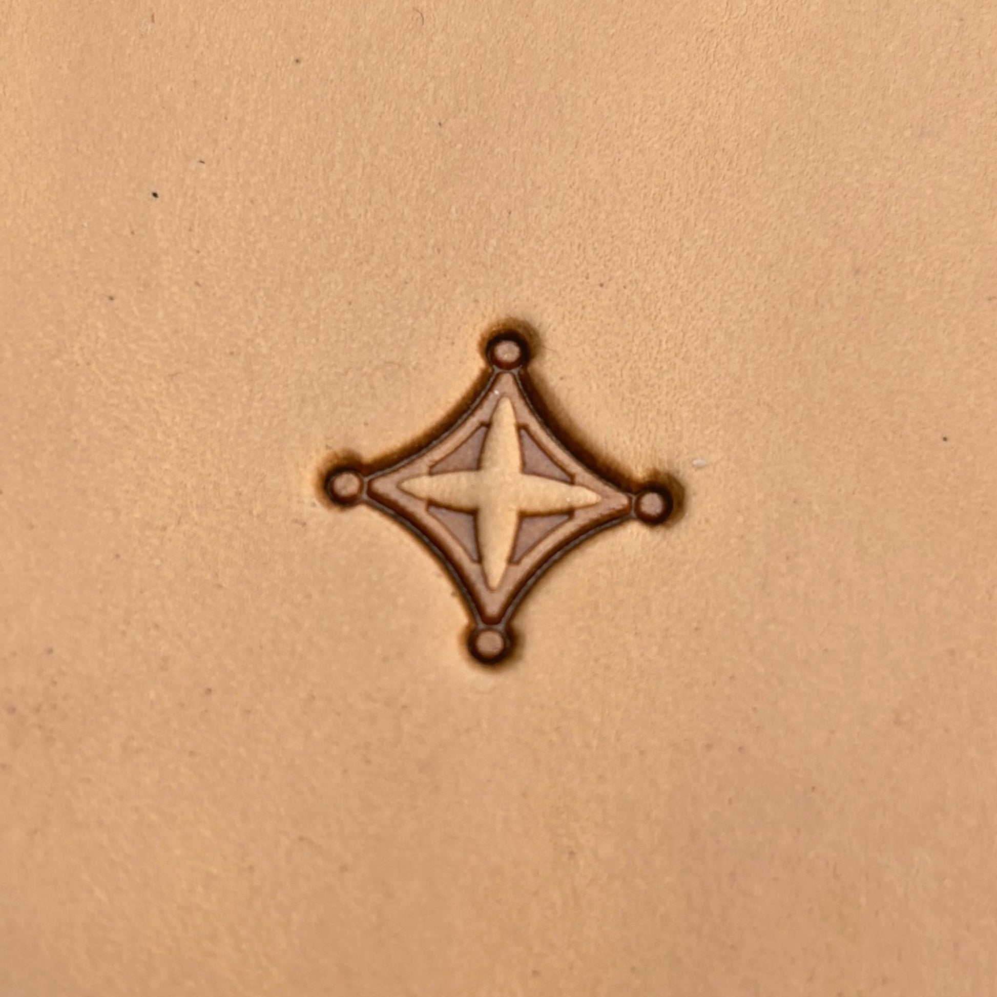 Geometric leather stamp LT228 — single impression on veg-tan leather