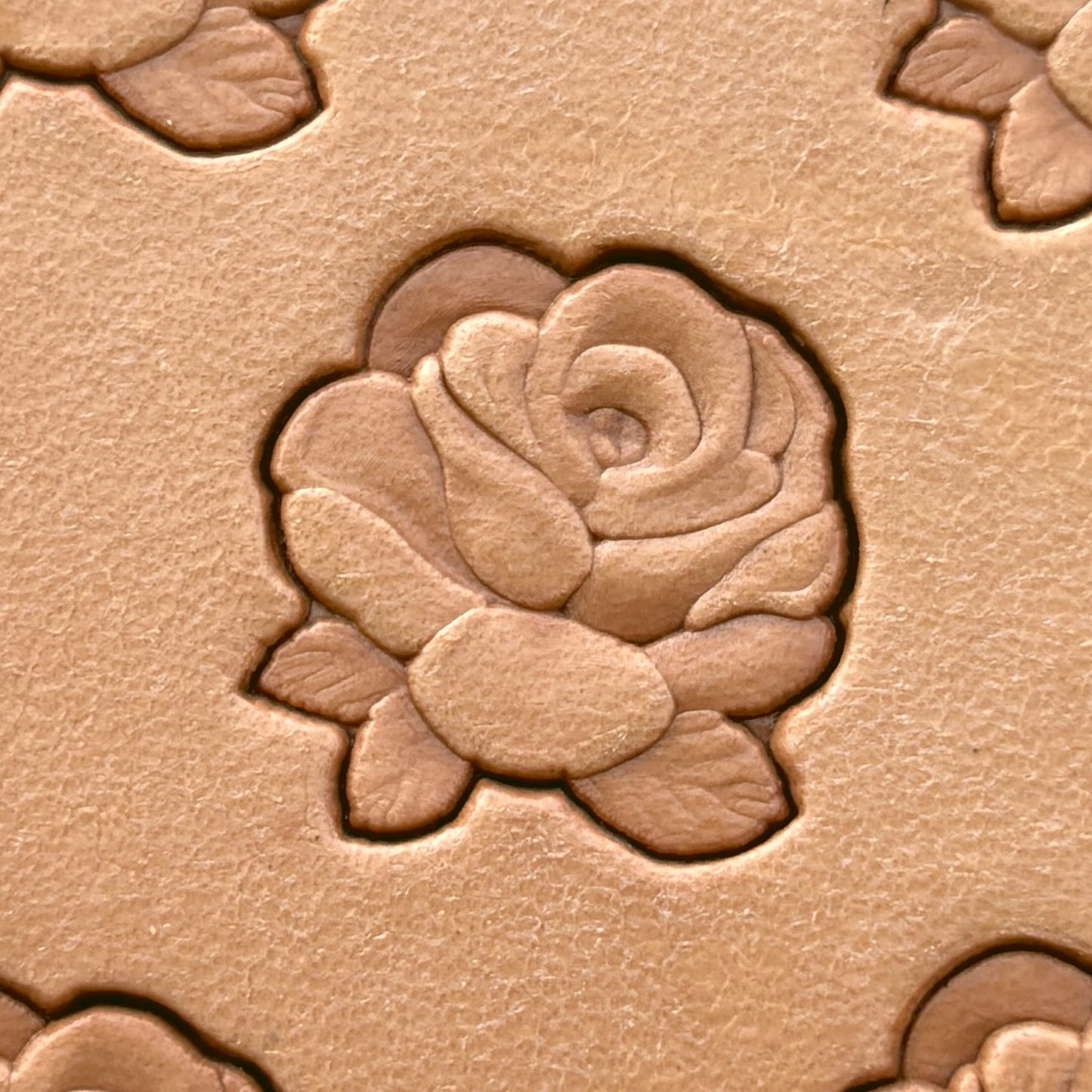 Small Cluster Rose leather stamp LT235 — single impression on veg-tan leather