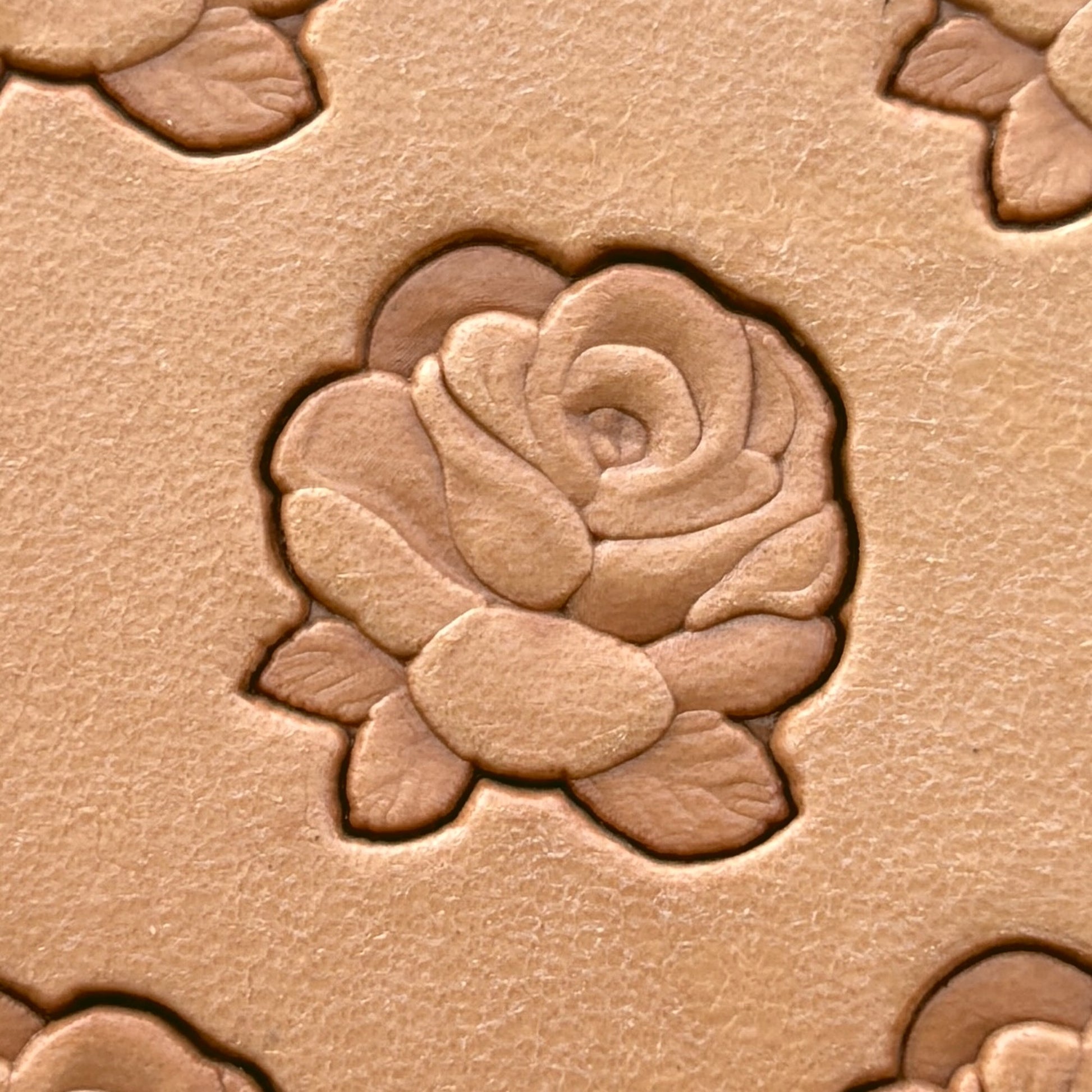 Small Cluster Rose leather stamp LT235 — single impression on veg-tan leather