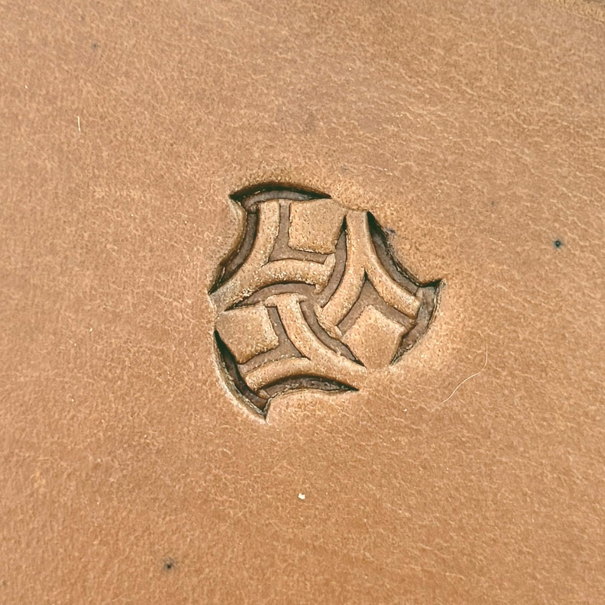Interlock Shape Geometric leather stamp LT241 — single impression on veg-tan leather
