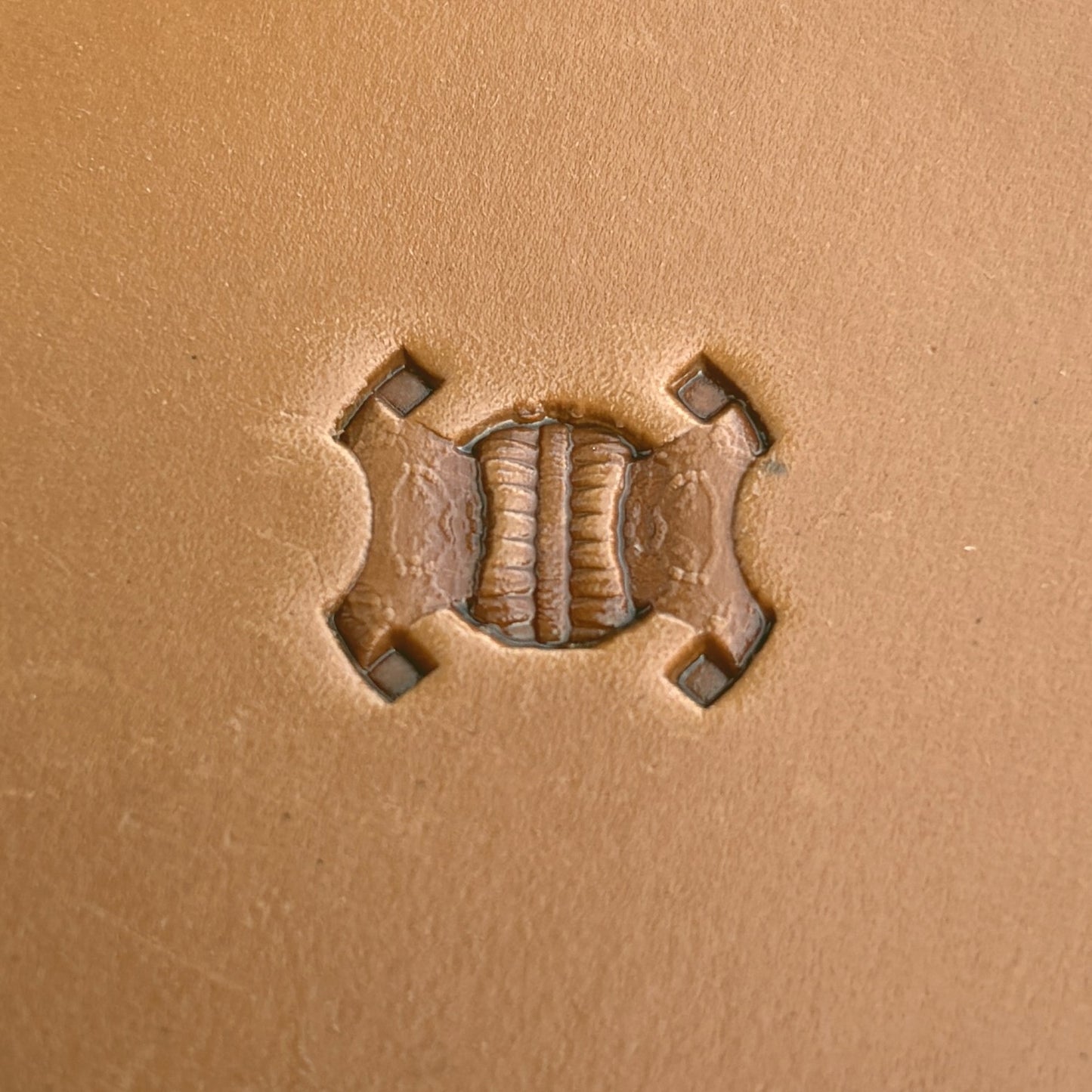 Geometric leather stamp LT246 — single impression on veg-tan leather