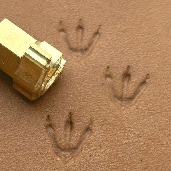 Dinosaur Track Footprint leather stamp LT250 — brass stamping tool with imprint on natural veg-tan leather