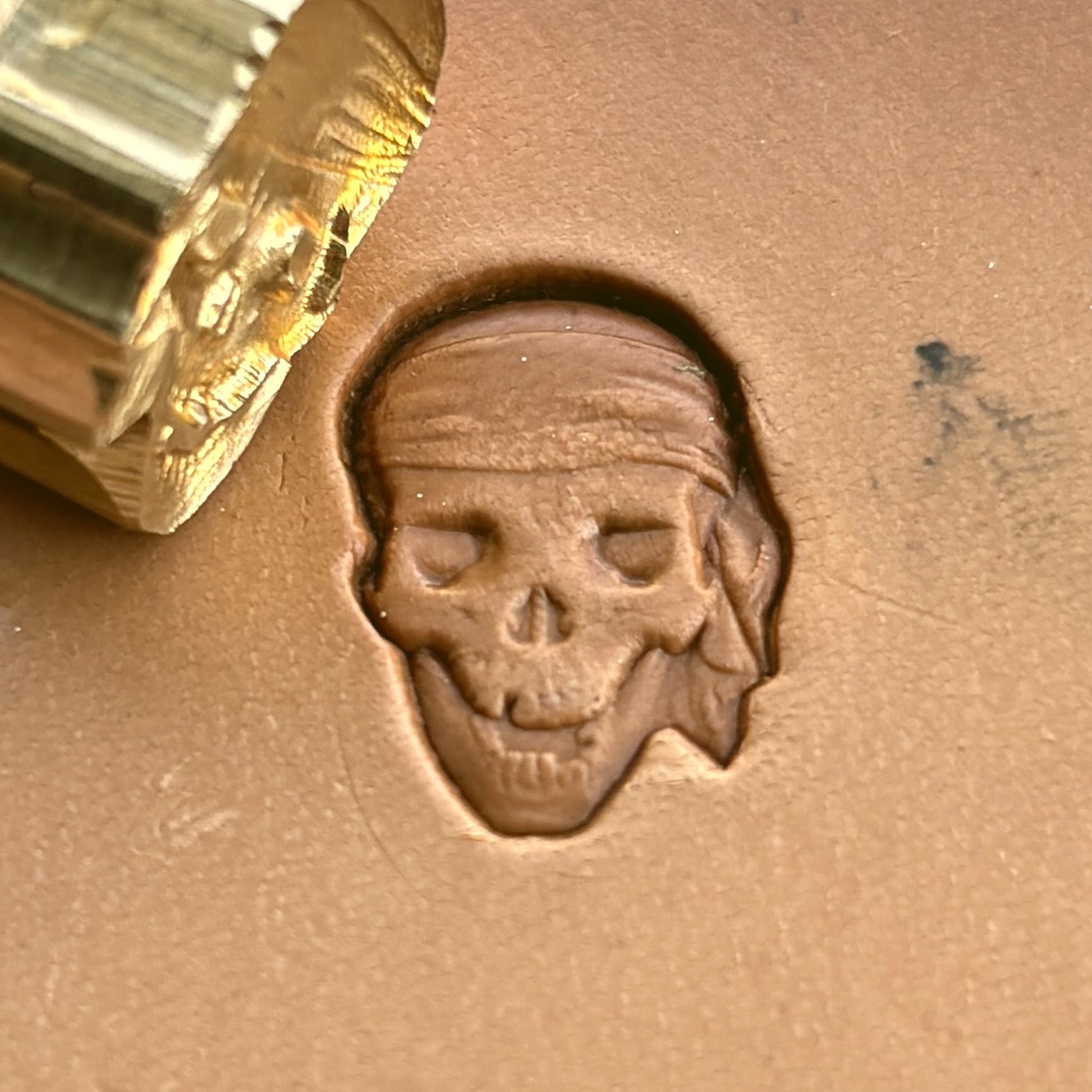Skull leather stamp LT253 — brass stamping tool with imprint on natural veg-tan leather