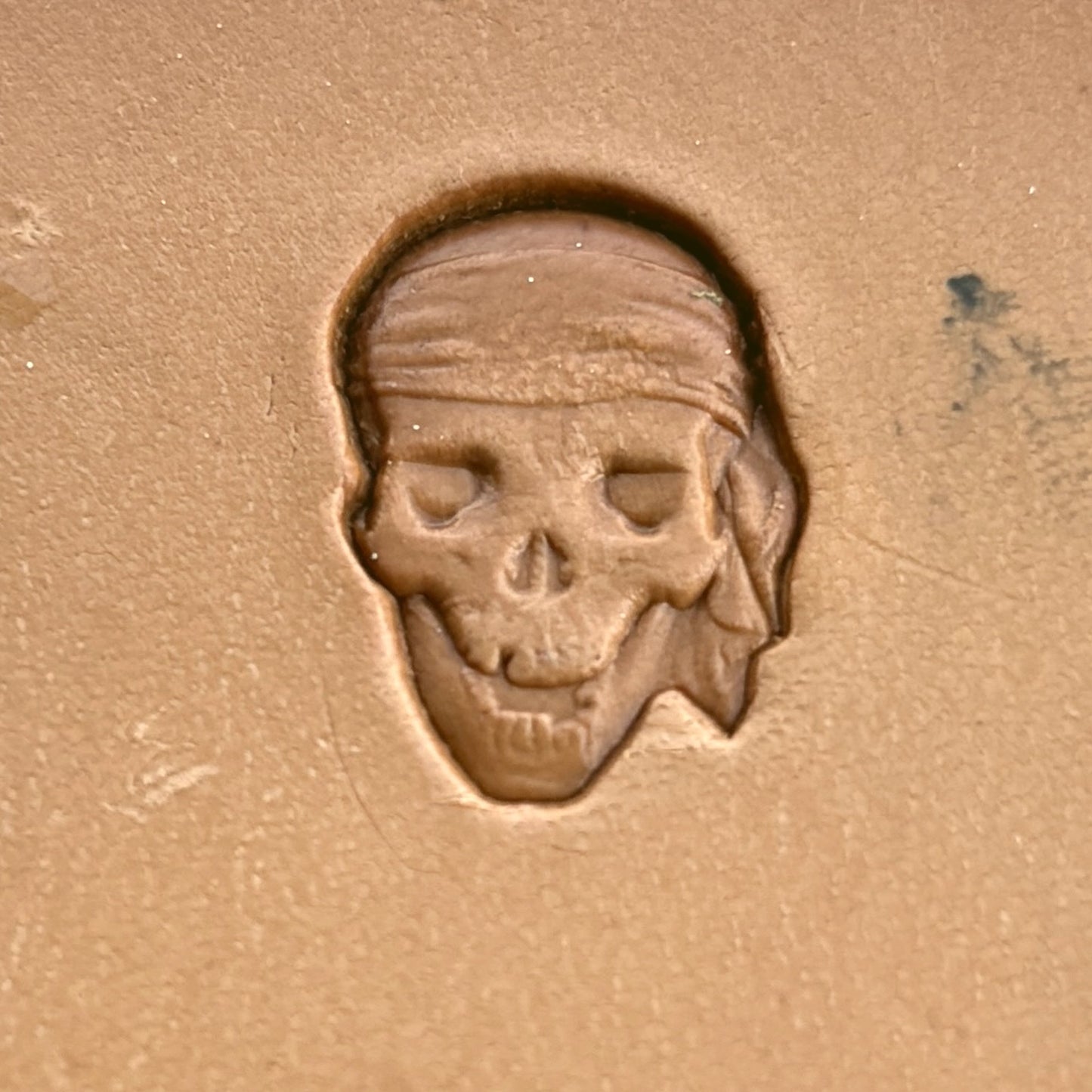Skull leather stamp LT253 — single impression on veg-tan leather