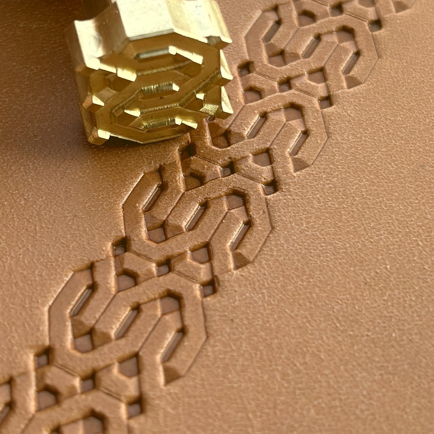 Geometric leather stamp LT258 — brass stamping tool with imprint on natural veg-tan leather