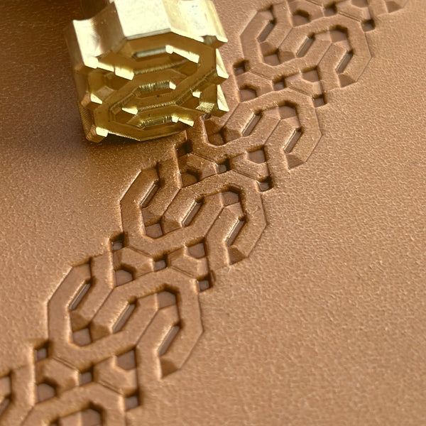 Geometric leather stamp LT258 — brass stamping tool with imprint on natural veg-tan leather