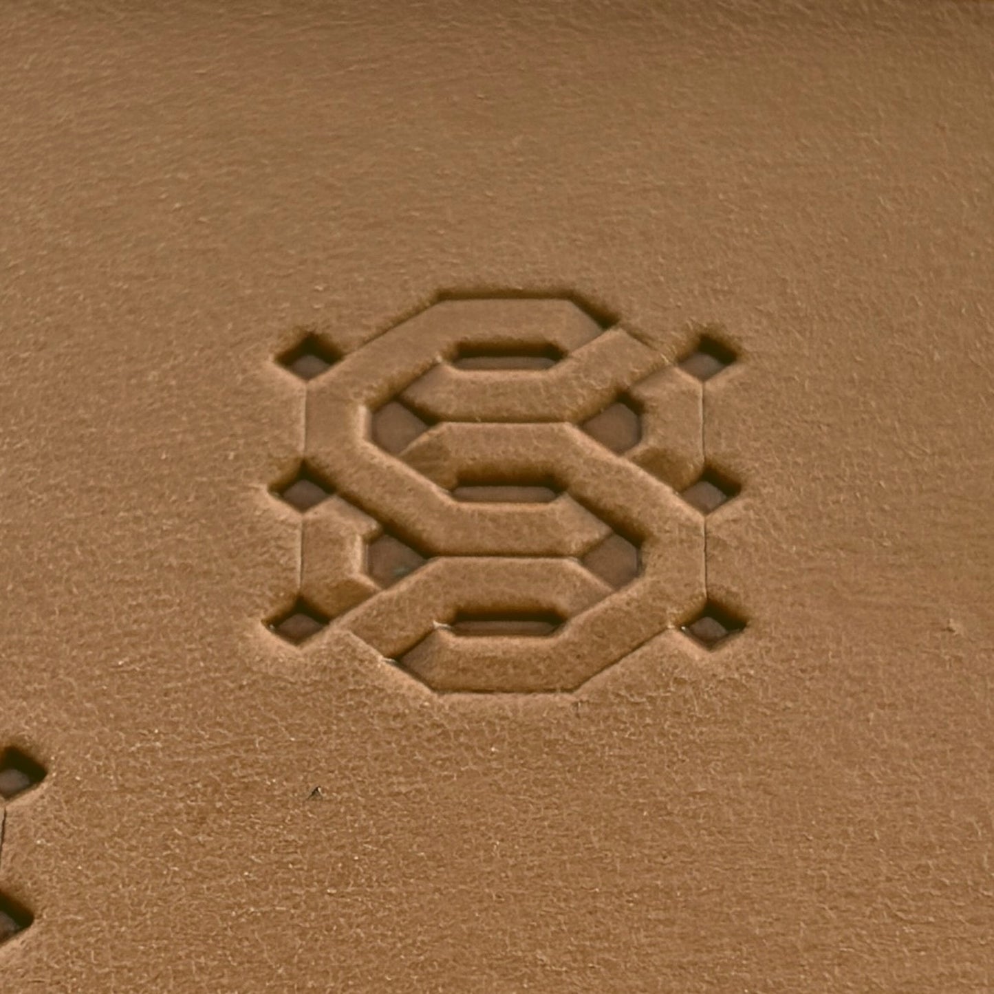 Geometric leather stamp LT258 — single impression on veg-tan leather