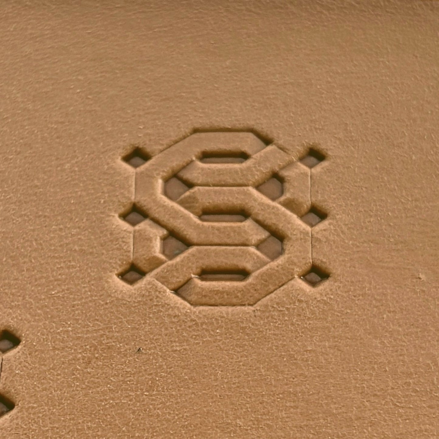Geometric leather stamp LT258 — single impression on veg-tan leather