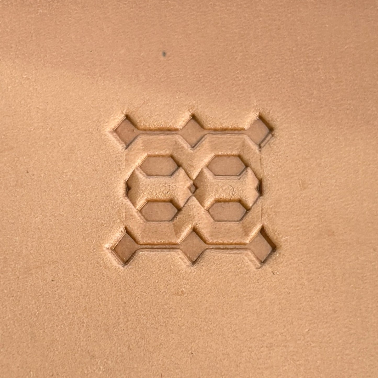 Geometric leather stamp LT259 — single impression on veg-tan leather