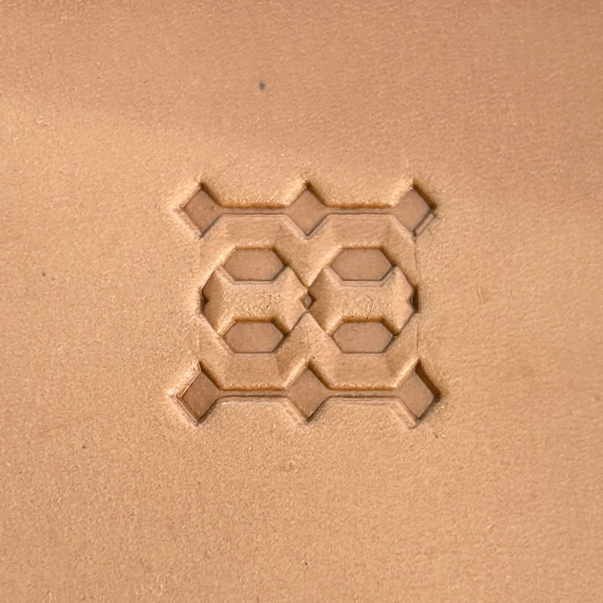 Geometric leather stamp LT259 — single impression on veg-tan leather
