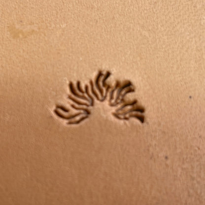 Curved Spiky Motif leather stamp LT261 — single impression on veg-tan leather