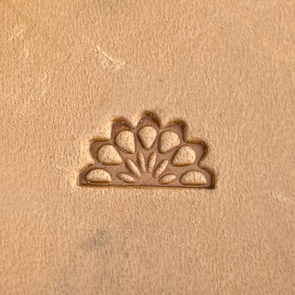 Peacock leather stamp LT264 — single impression on veg-tan leather