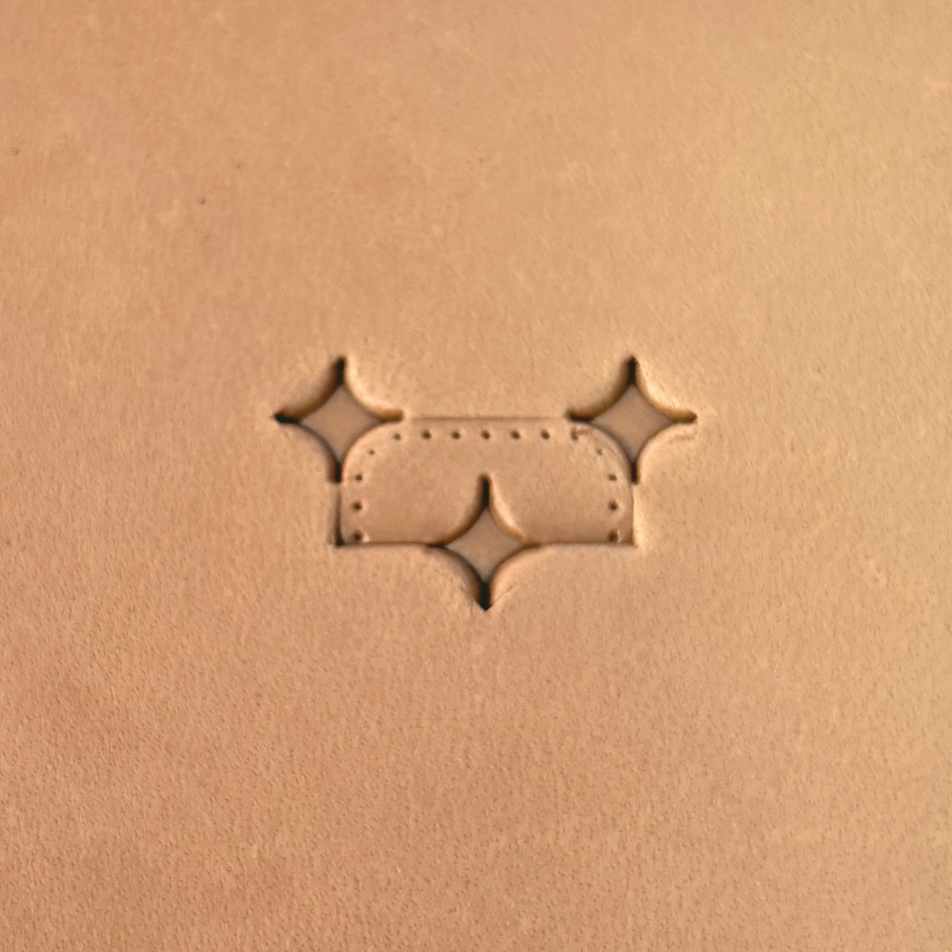 Star Tiles leather stamp LT273 — pattern imprint on veg-tan leather