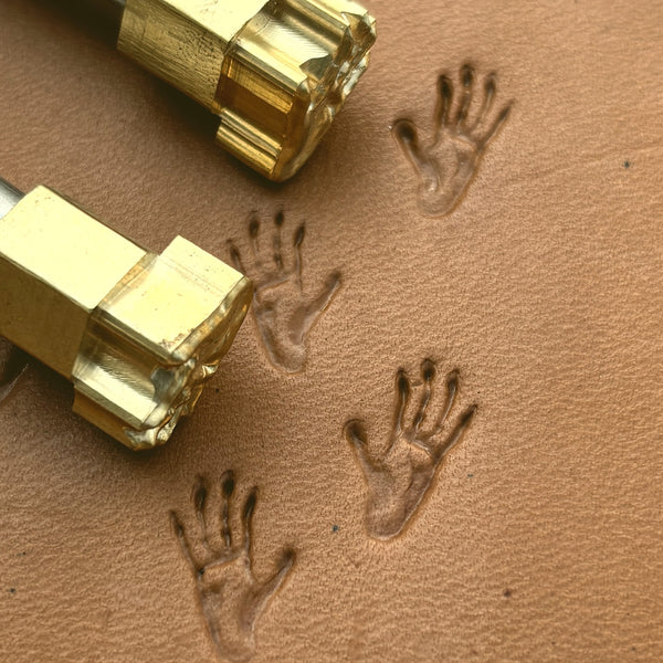 Monkey Tracks Footprint leather stamp LT275 — brass stamping tool with imprint on natural veg-tan leather