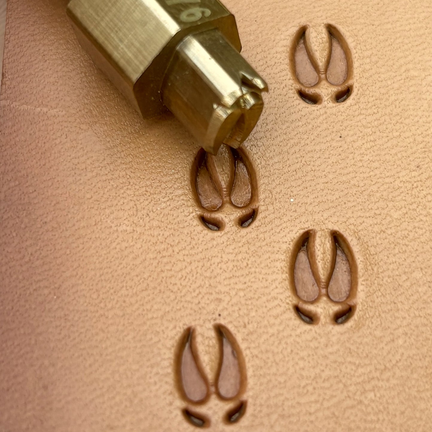 Hoof Tracks Footprint leather stamp LT276 — brass stamping tool with imprint on natural veg-tan leather