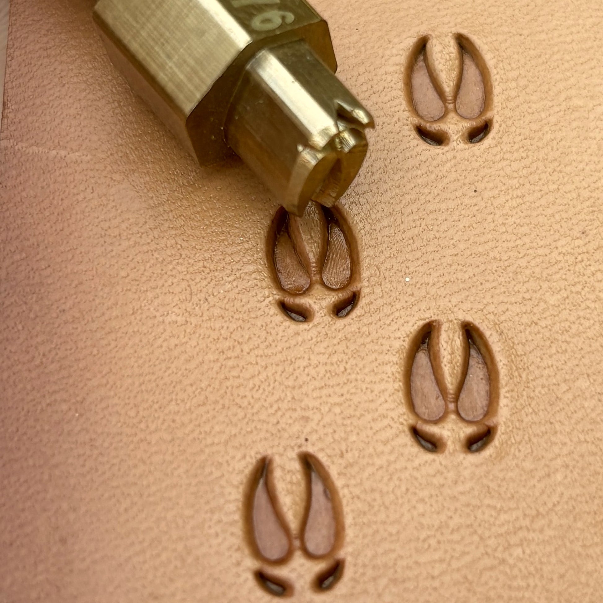 Hoof Tracks Footprint leather stamp LT276 — brass stamping tool with imprint on natural veg-tan leather