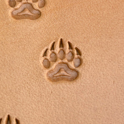 Track Paw Bear leather stamp LT279 — single impression on veg-tan leather