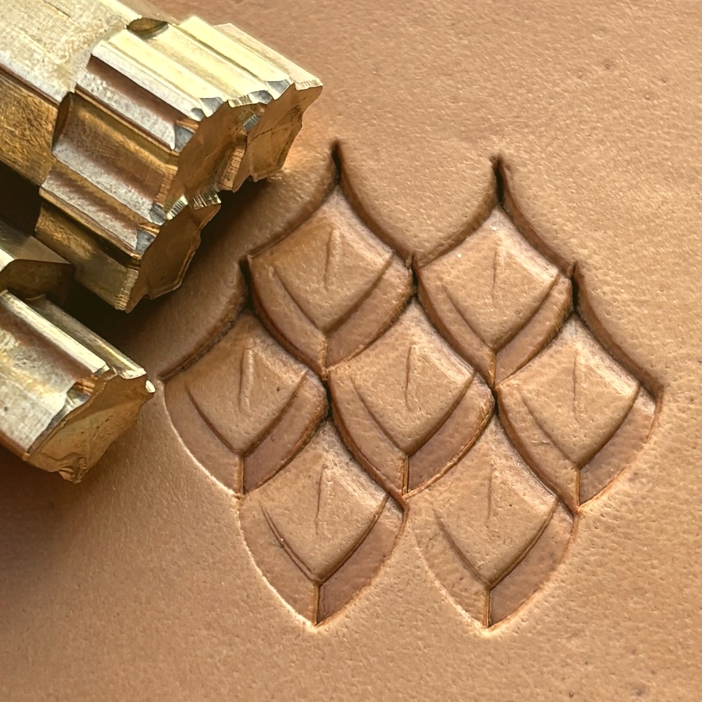 Geometric leather stamp LT284 — brass stamping tool with imprint on natural veg-tan leather