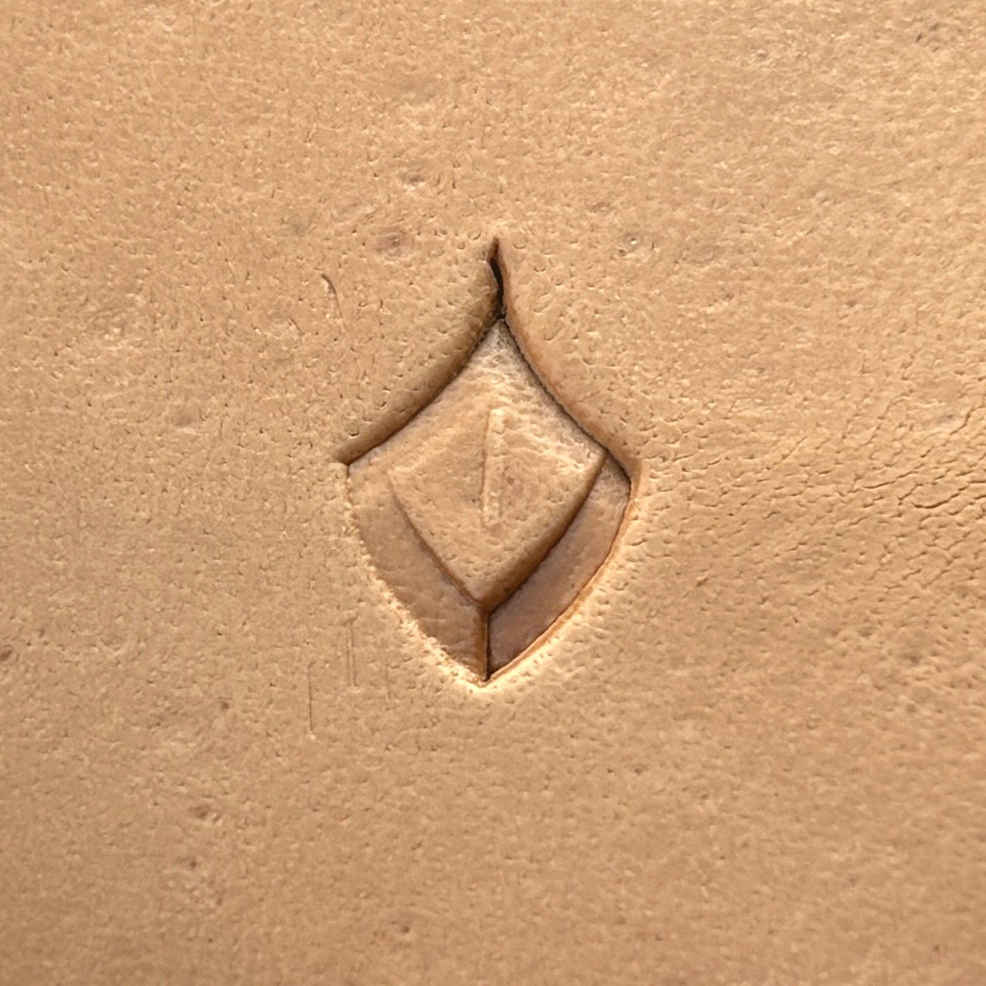 Geometric leather stamp LT284 — single impression on veg-tan leather