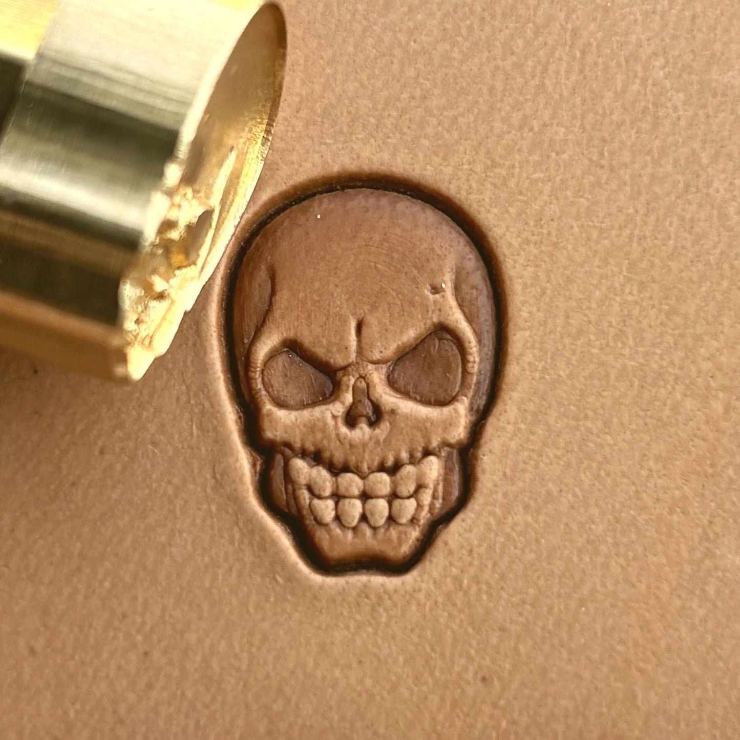 Skull leather stamp LT287 — brass stamping tool with imprint on natural veg-tan leather