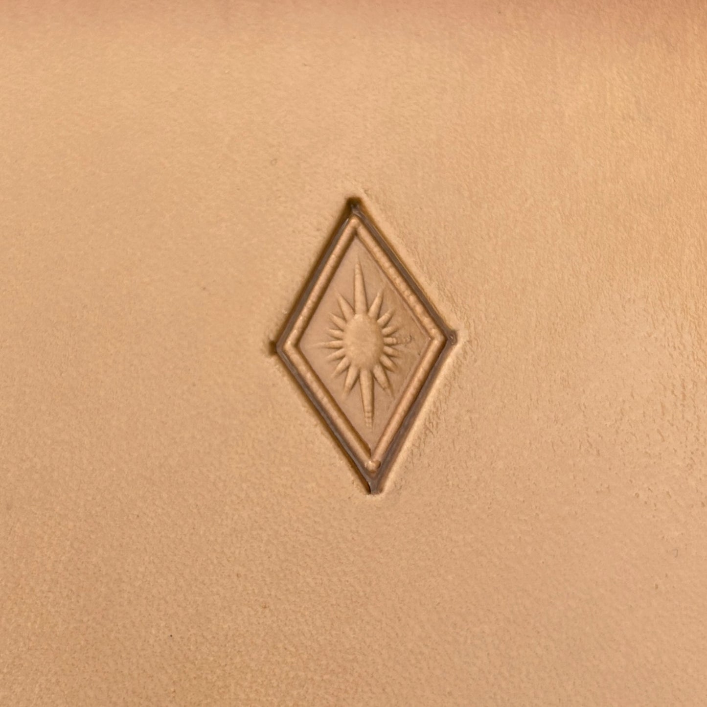 Sunburst Diamonds Geometric leather stamp LT292 — single impression on veg-tan leather