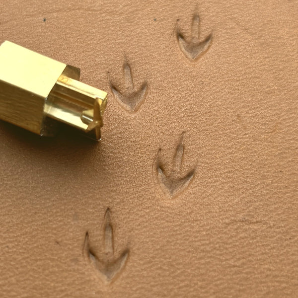 Bird Track Footprint leather stamp LT296 — brass stamping tool with imprint on natural veg-tan leather