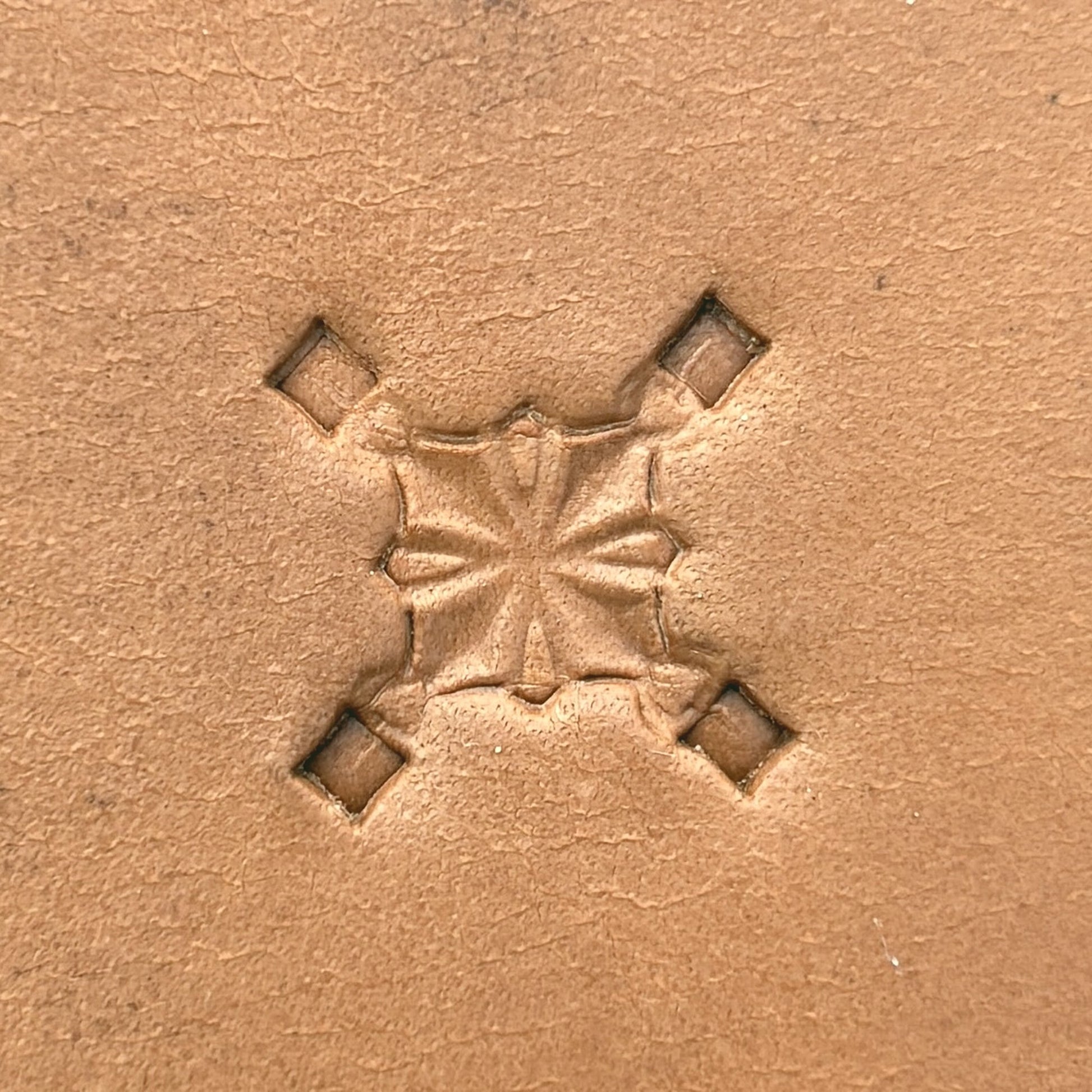 Star Center Geometric leather stamp LT304 — single impression on veg-tan leather