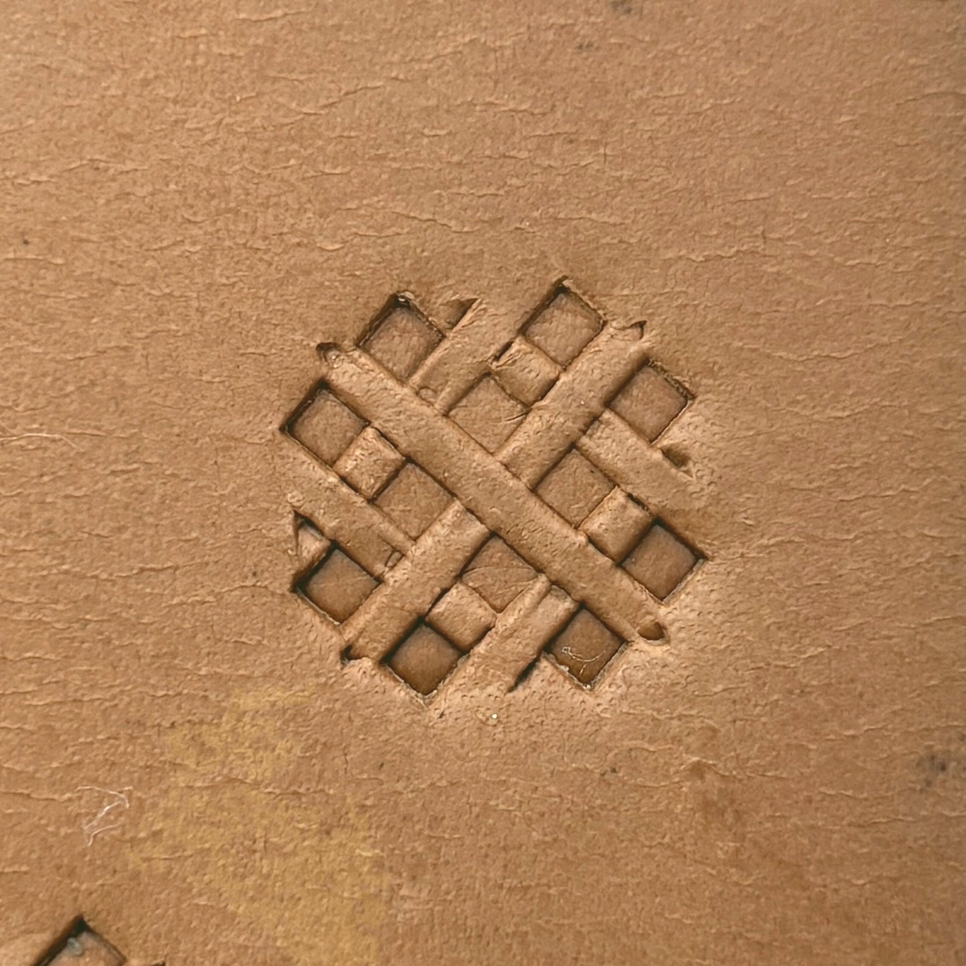 Diamond Grid Basket Weave leather stamp LT306 — single impression on veg-tan leather