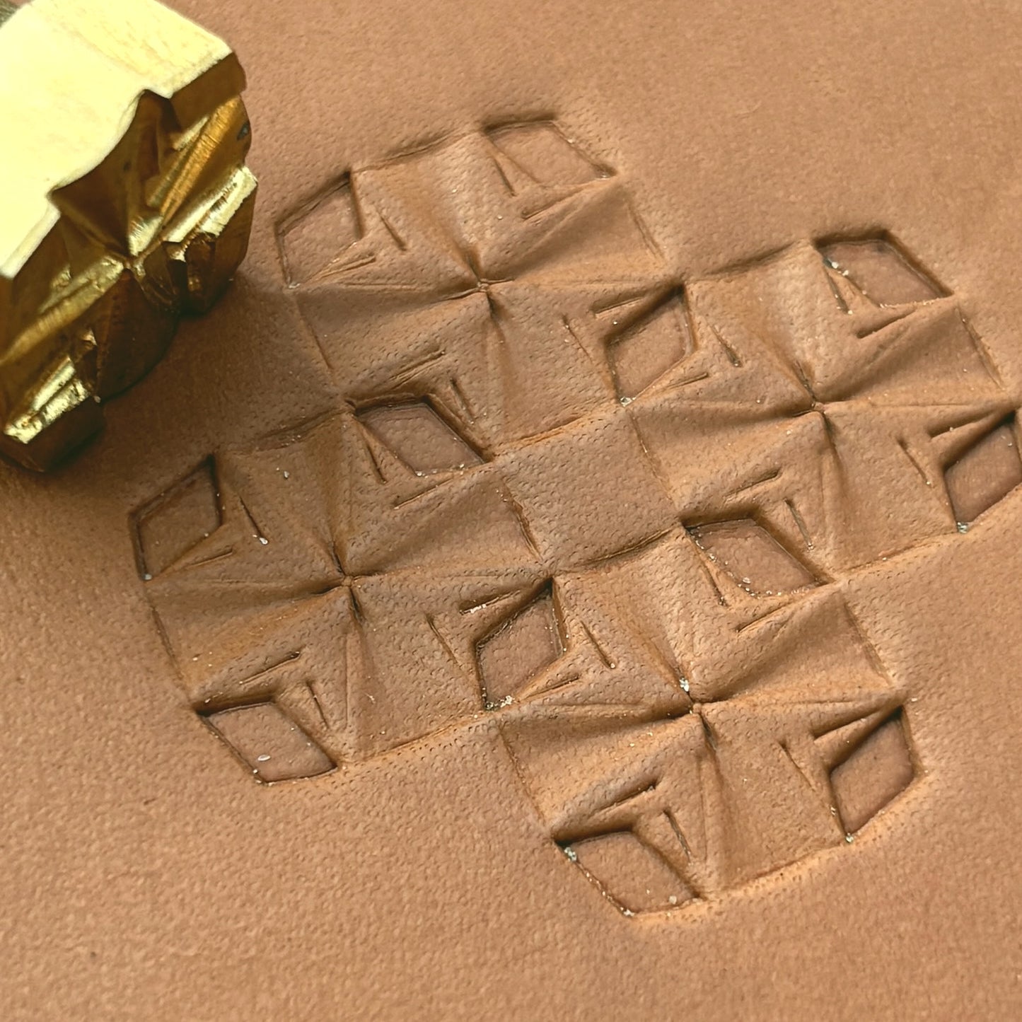 Folded Star Geometric leather stamp LT307 — brass stamping tool with imprint on natural veg-tan leather
