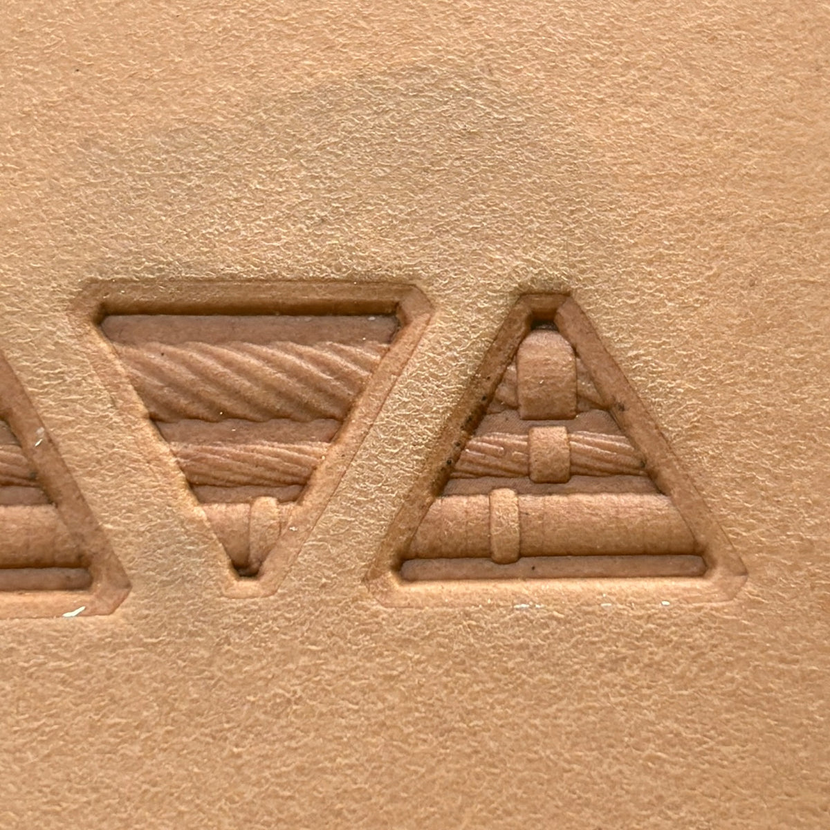 Geometric leather stamp LT313 — single impression on veg-tan leather