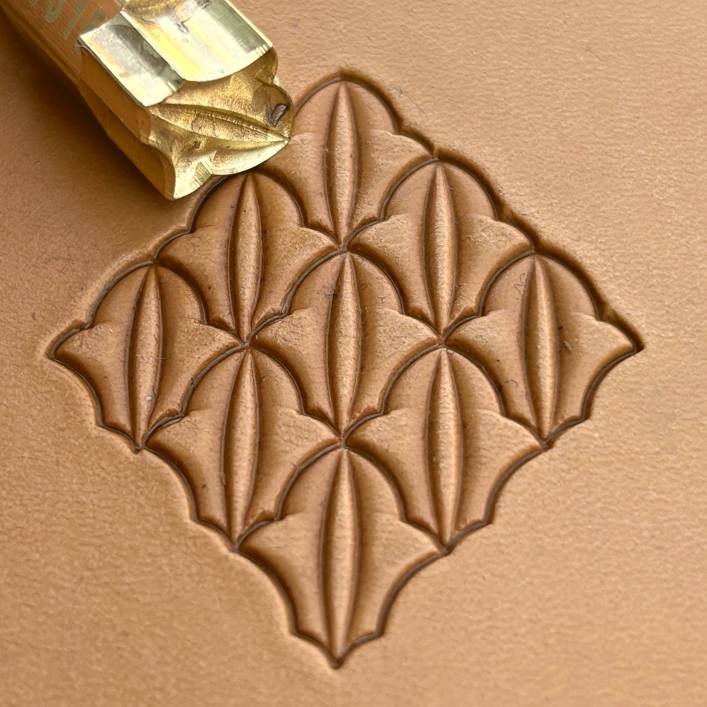 Geometric leather stamp LT315 — brass stamping tool with imprint on natural veg-tan leather