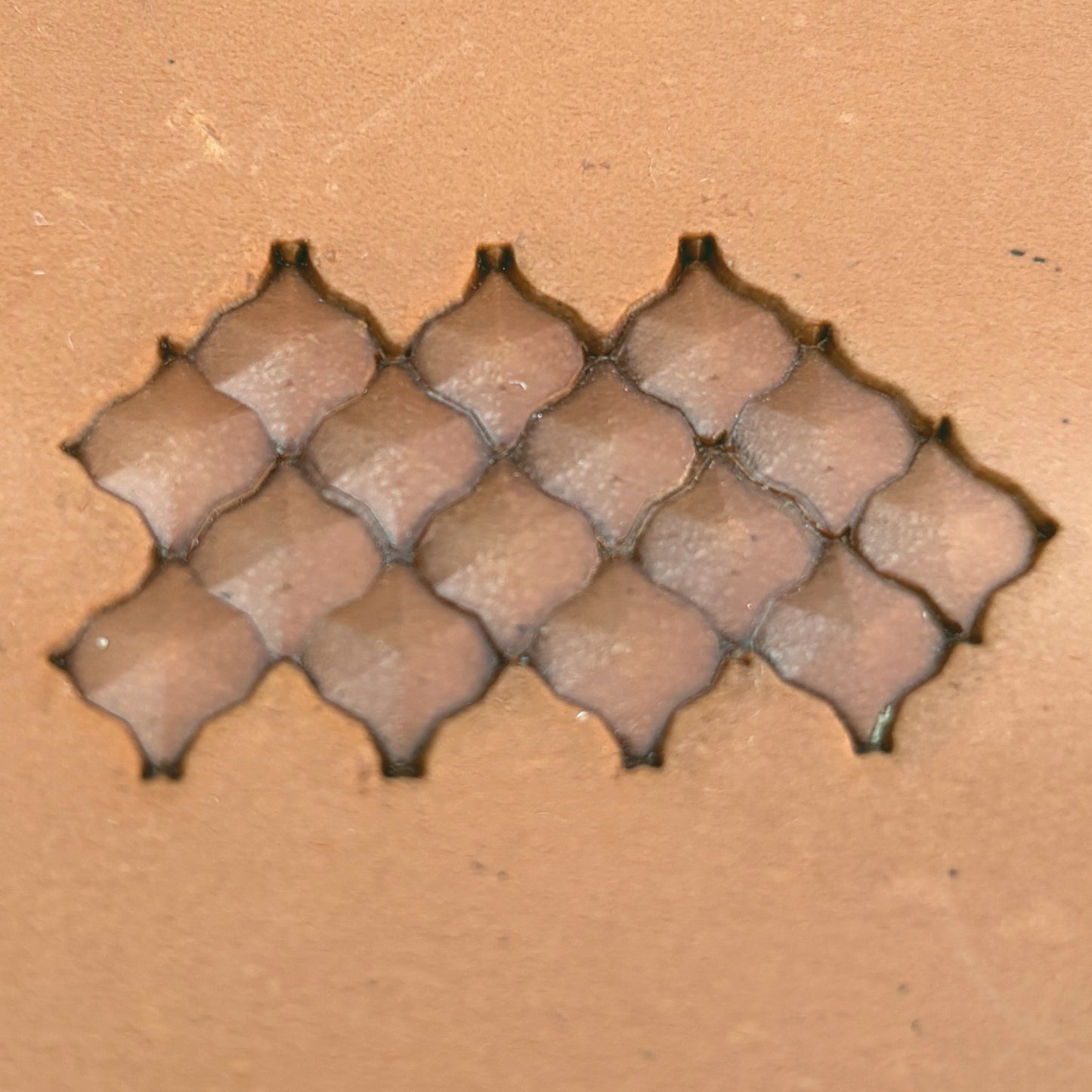 Geometric leather stamp LT320 — brass stamping tool with imprint on natural veg-tan leather