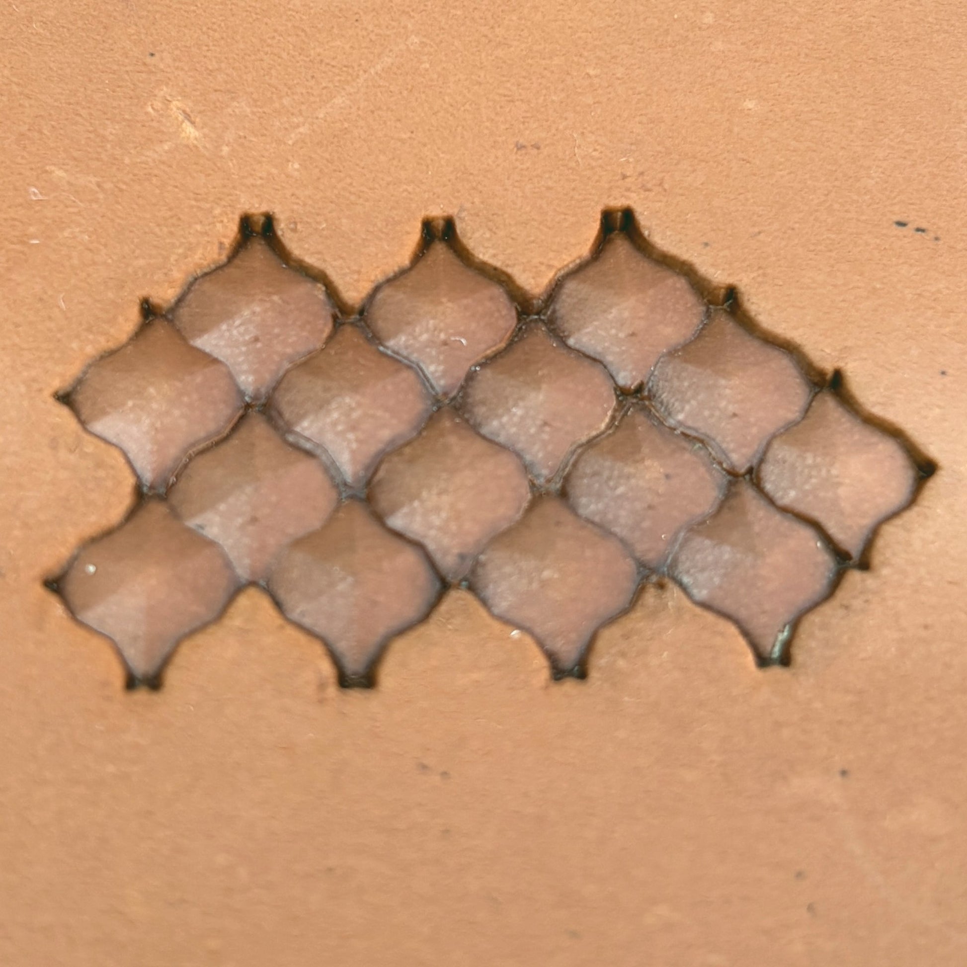 Geometric leather stamp LT320 — brass stamping tool with imprint on natural veg-tan leather
