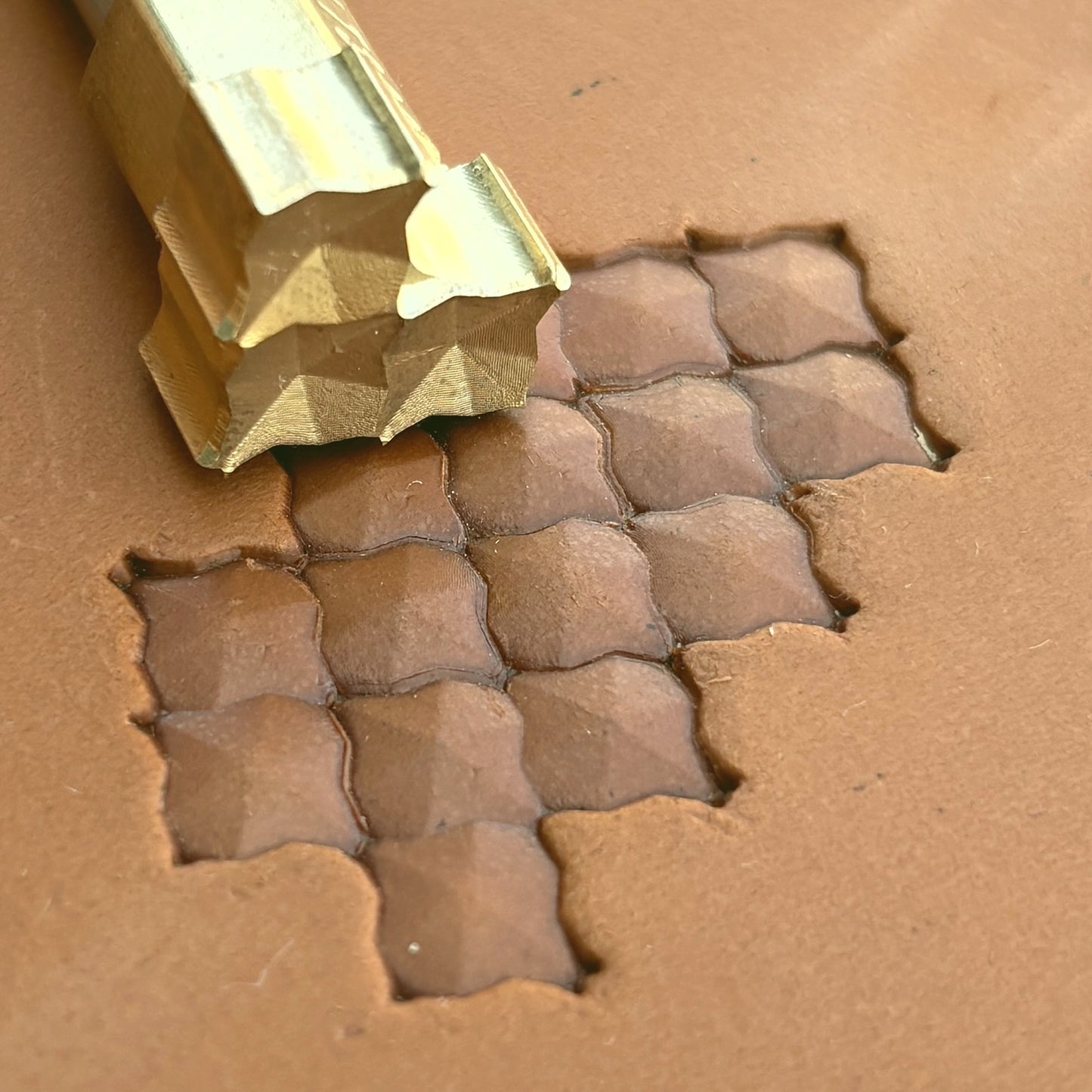 Geometric leather stamp LT320 — single impression on veg-tan leather