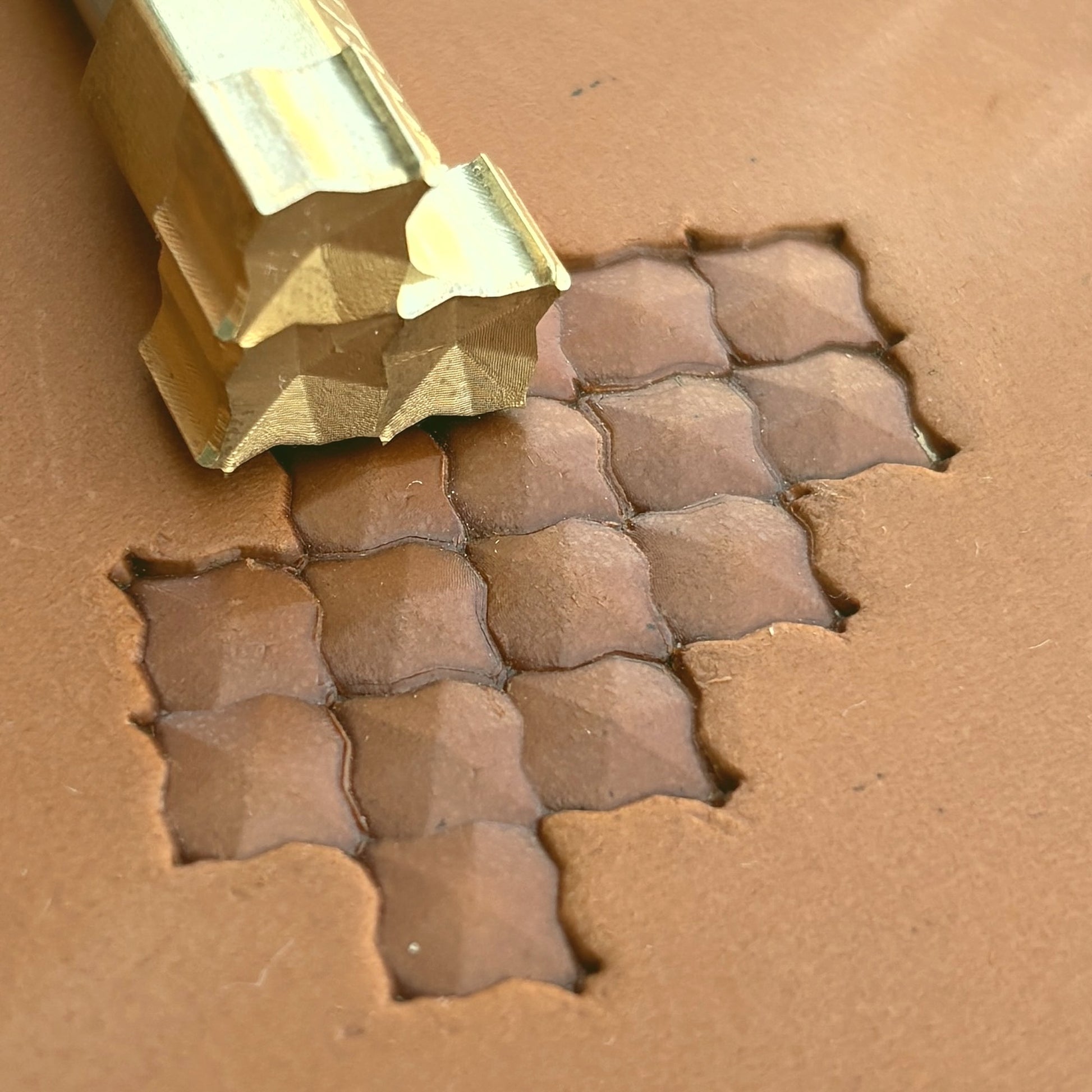 Geometric leather stamp LT320 — single impression on veg-tan leather