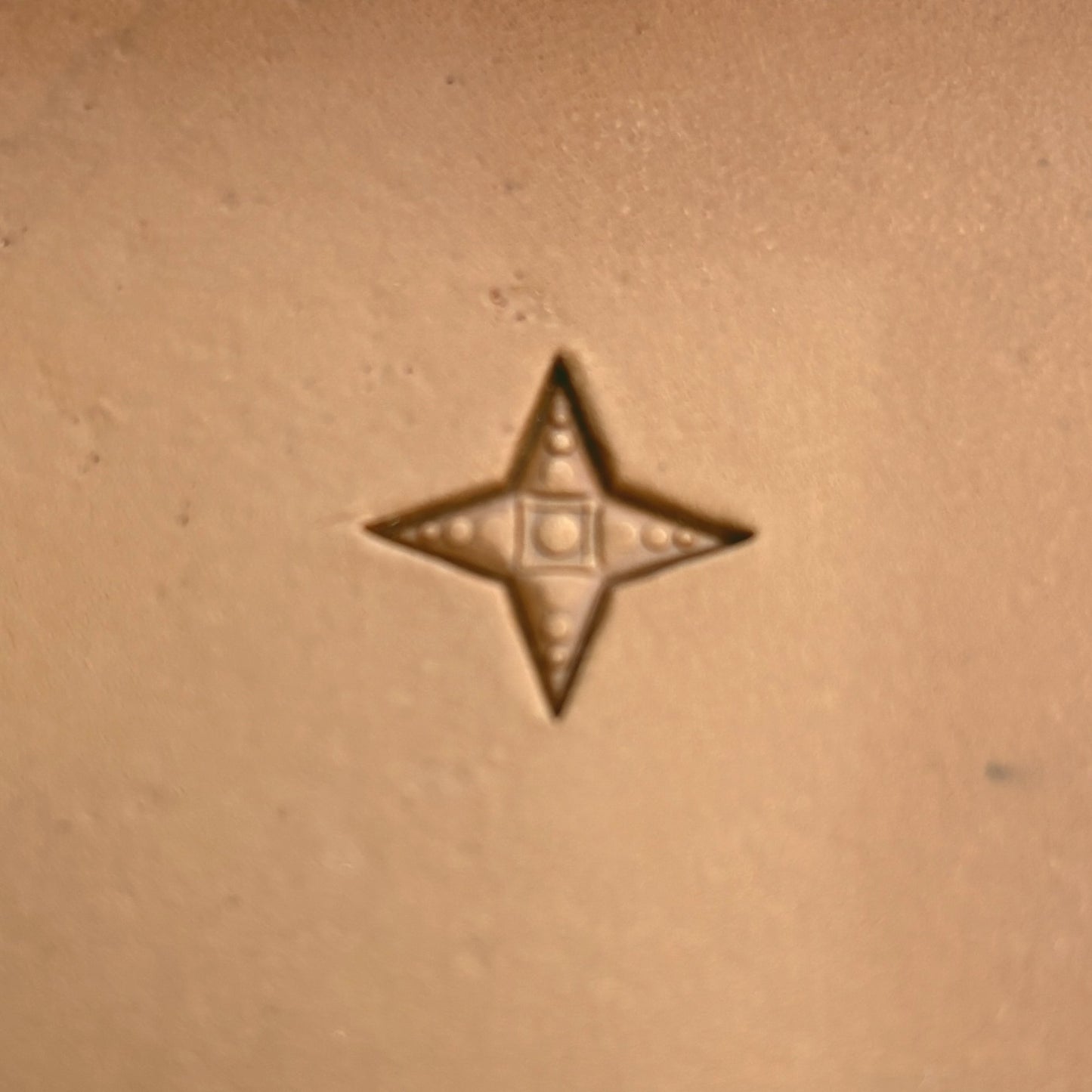Geometric leather stamp LT325 — single impression on veg-tan leather