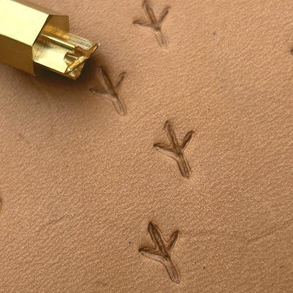 Bird Track Footprint leather stamp LT328 — brass stamping tool with imprint on natural veg-tan leather