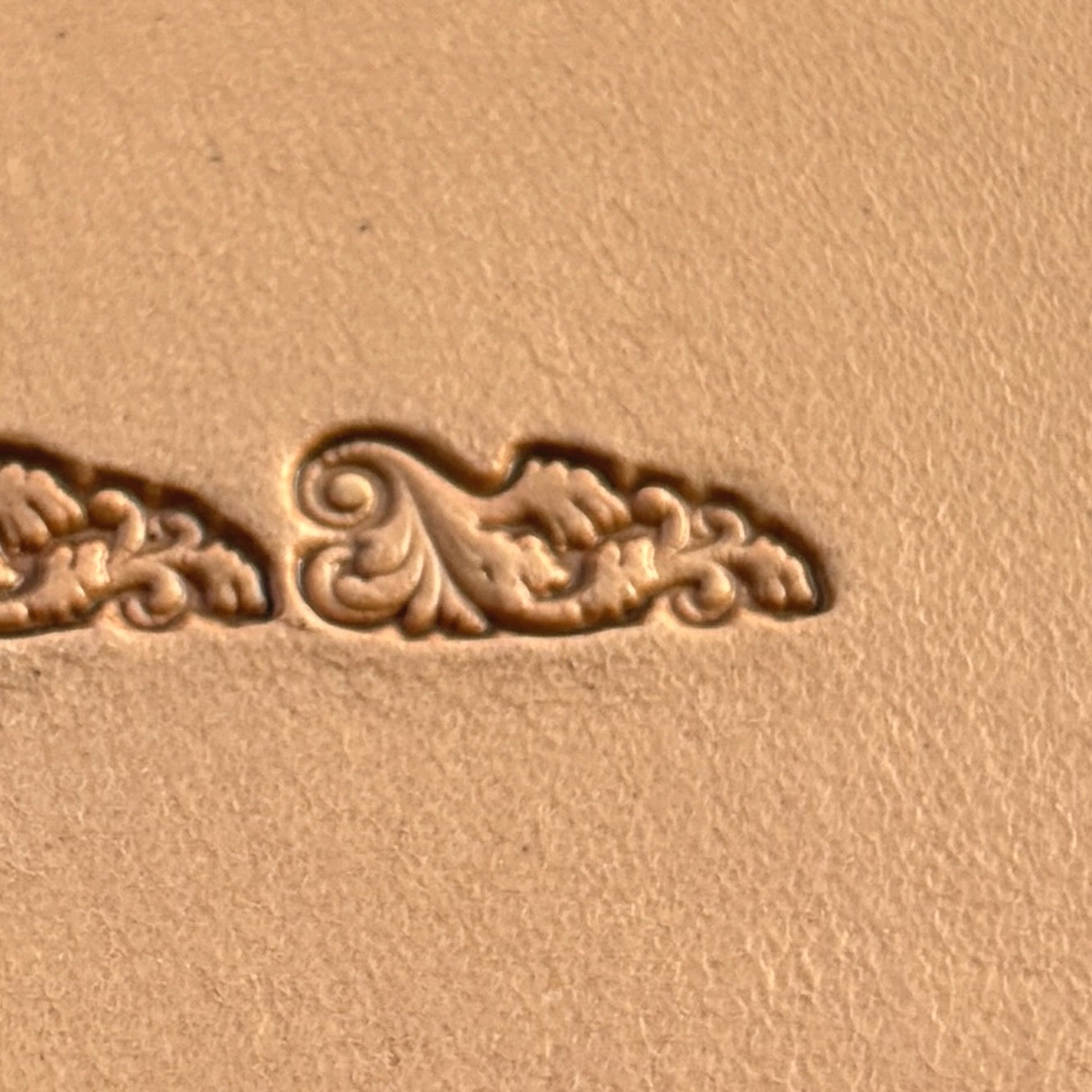 Scroll Border leather stamp LT331 — single impression on veg-tan leather