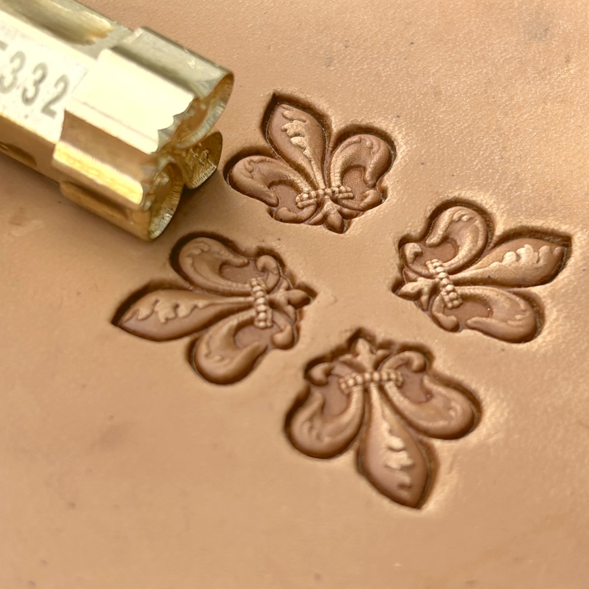 Fleur leather stamp LT332 — brass stamping tool with imprint on natural veg-tan leather