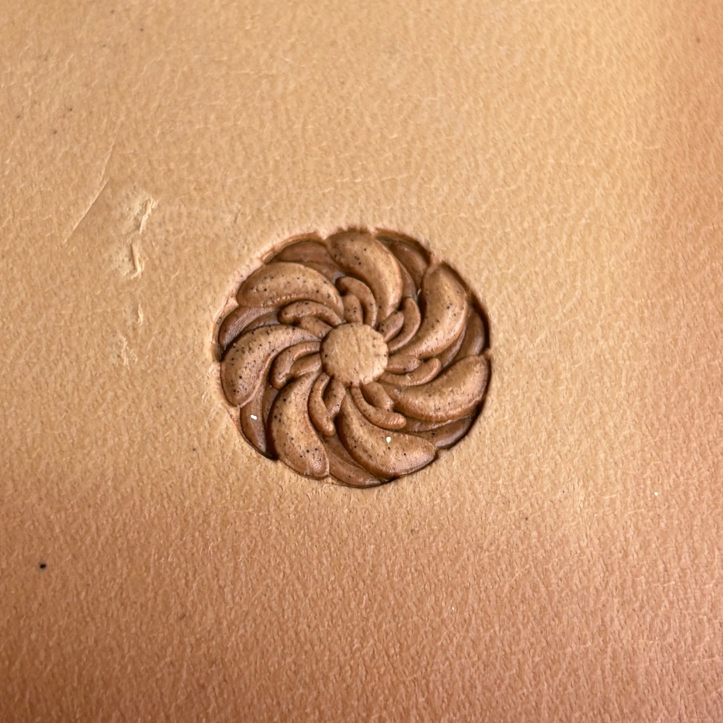 Swirl Mandala leather stamp LT333 — single impression on veg-tan leather