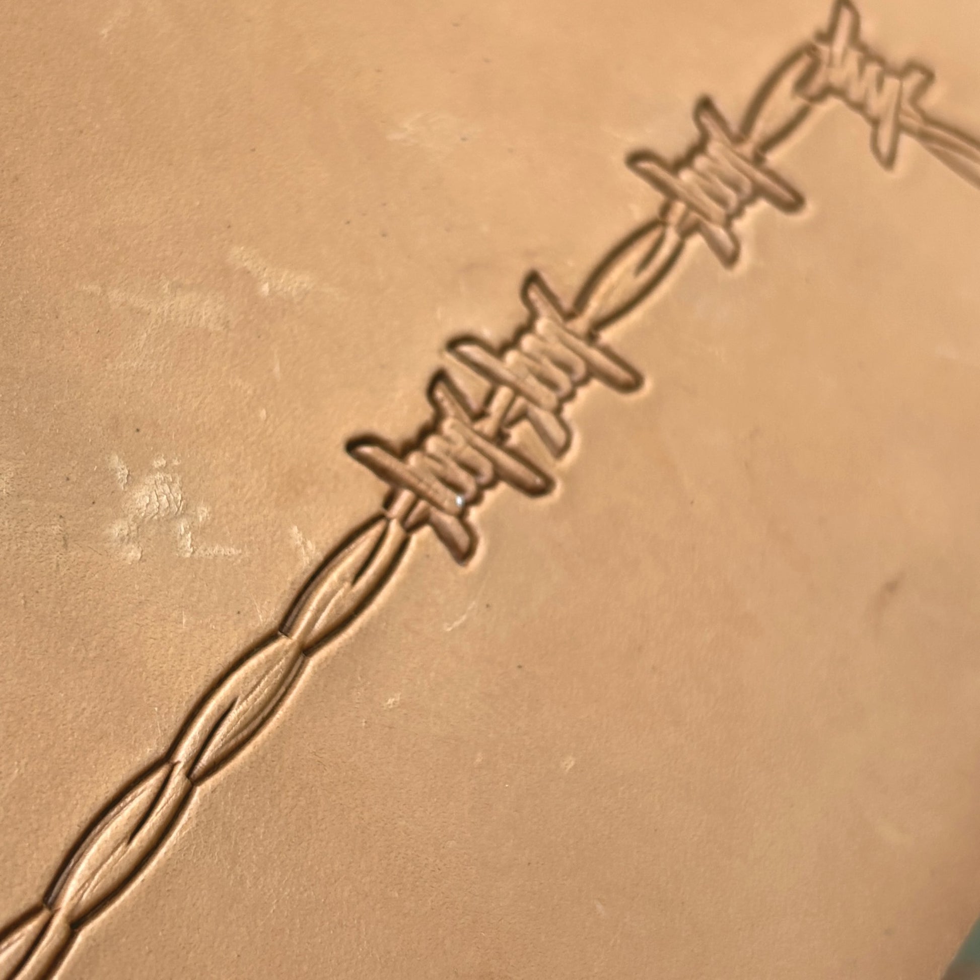 Barbed Wire leather stamp LT335 — pattern imprint on veg-tan leather