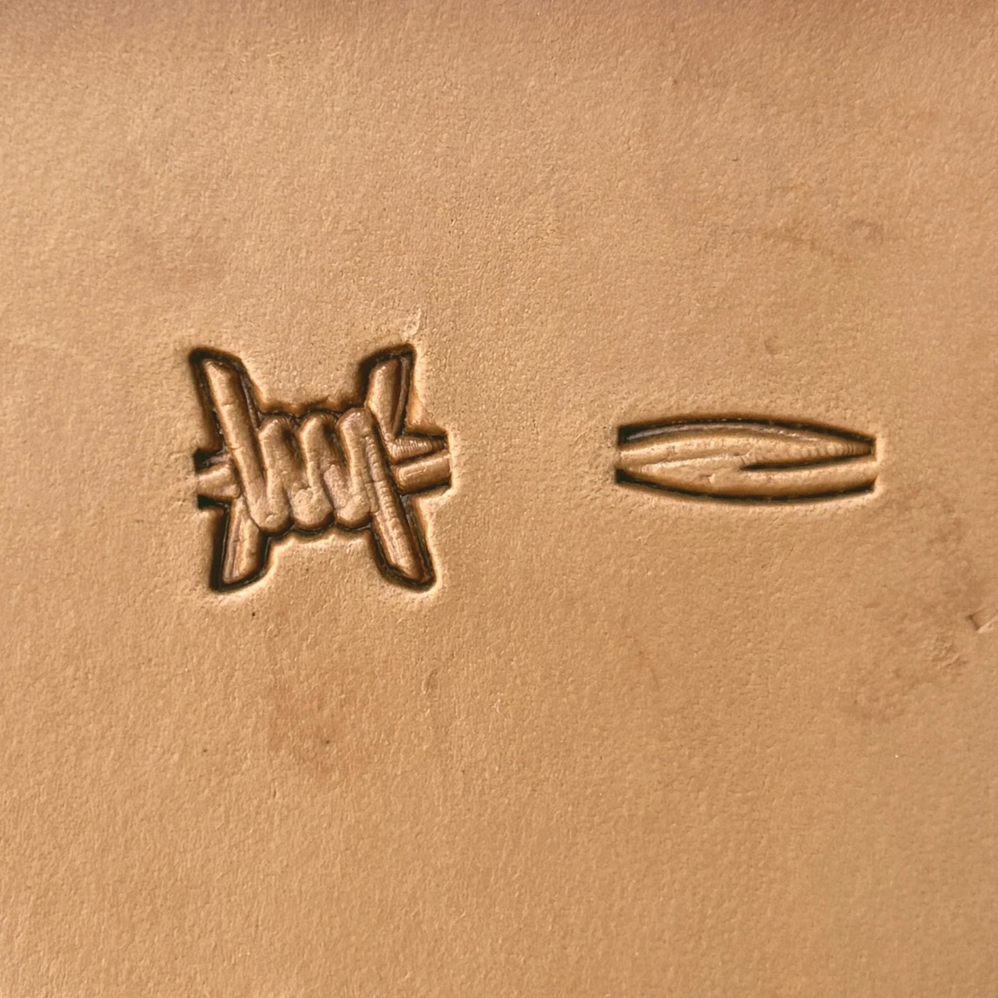 Barbed Wire leather stamp LT335 — single impression on veg-tan leather